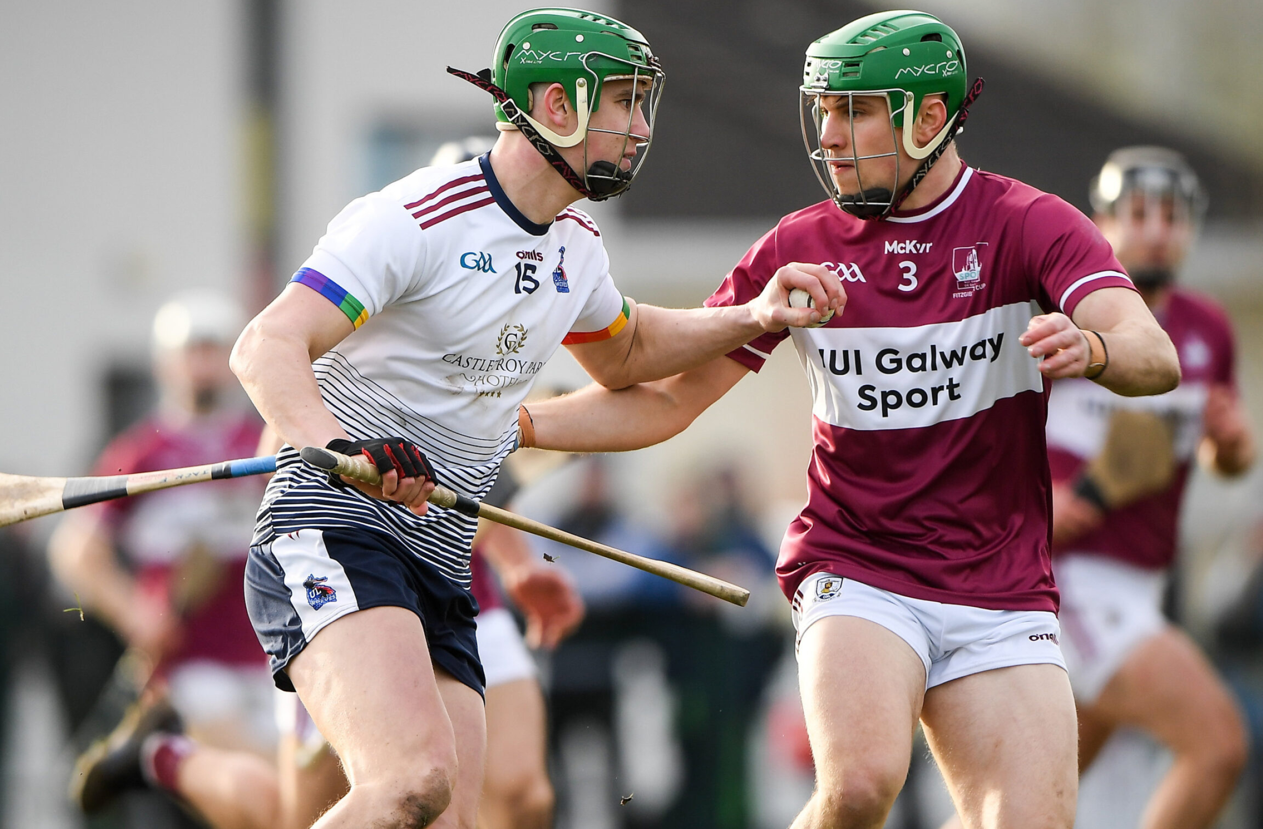 Hurling: Mikey Kiely of the University of Limerick against Jack Fitzpatrick of NUI Galway, Fitzgibbon Cup Finale. 2560x1690 HD Background.
