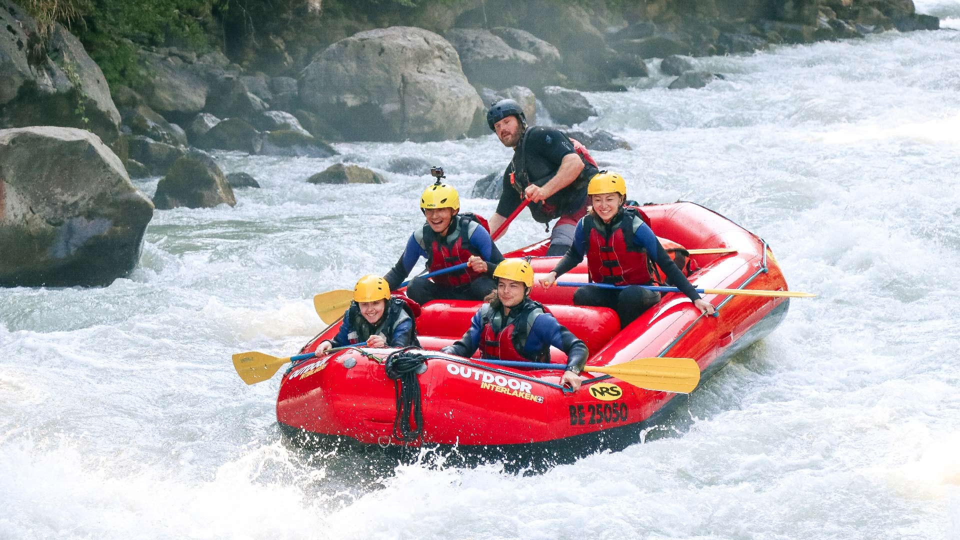 Rafting: Whitewater boating on an intense river full of powerful rapids. 1920x1080 Full HD Background.