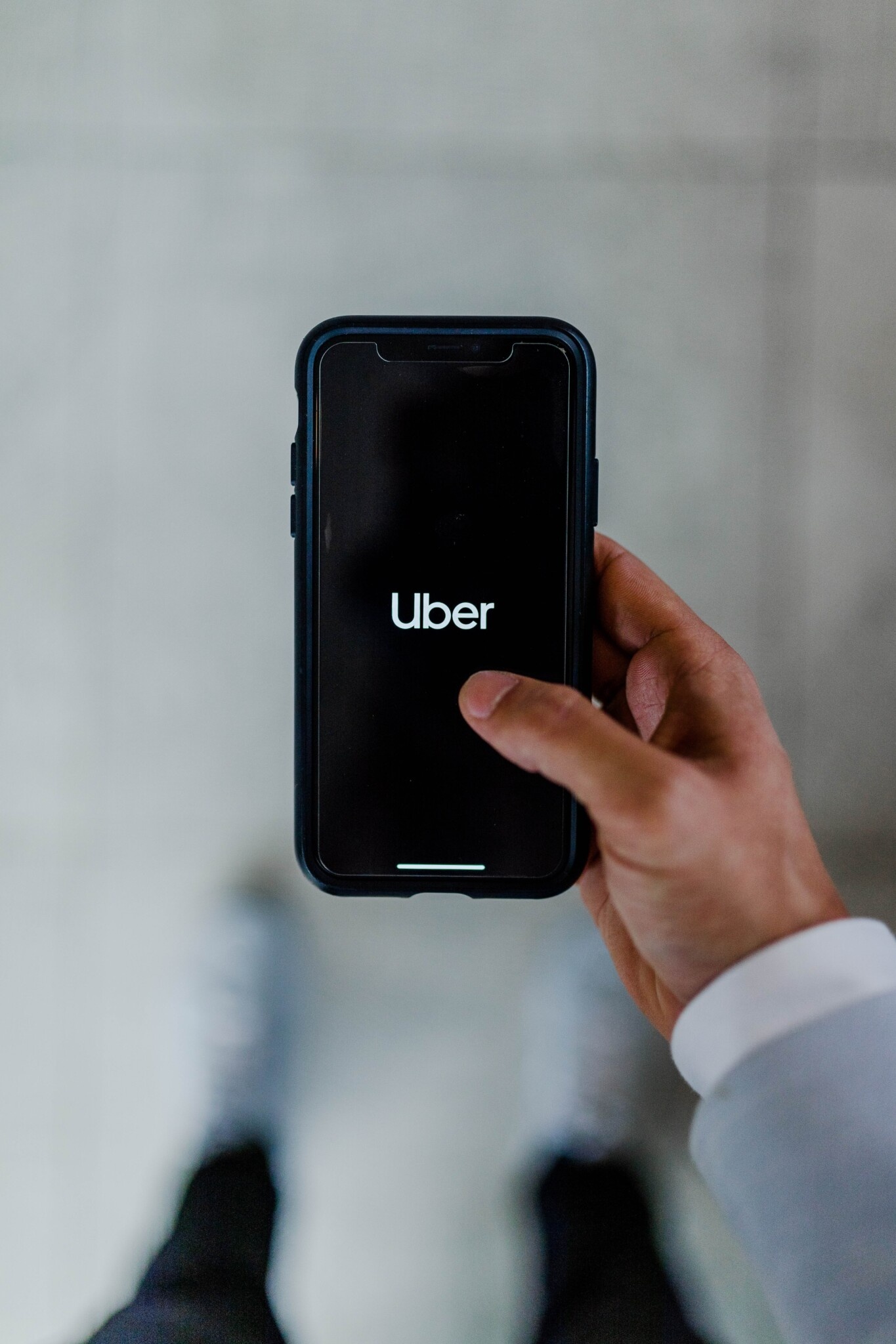 Uber: The world's largest ride-sharing company, The Uber app on a mobile device. 1370x2050 HD Wallpaper.