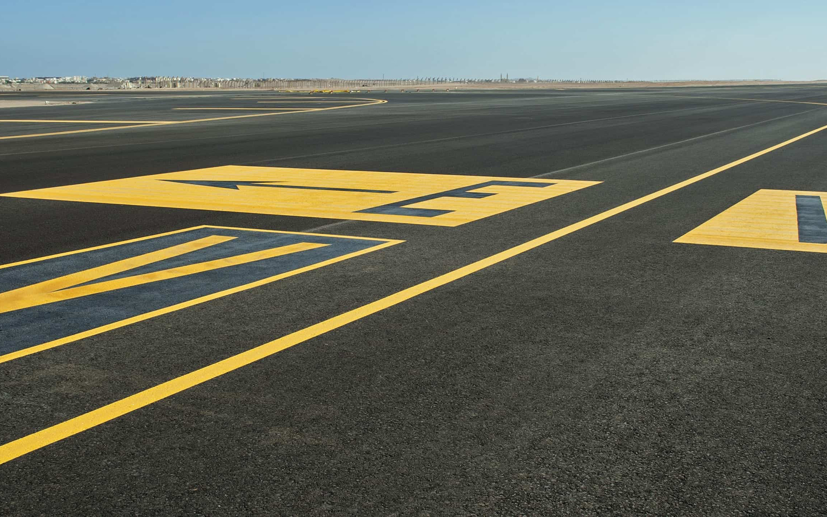 Airstrip: A long, flat surface constructed to support the weight and movement of planes. 2880x1800 HD Wallpaper.