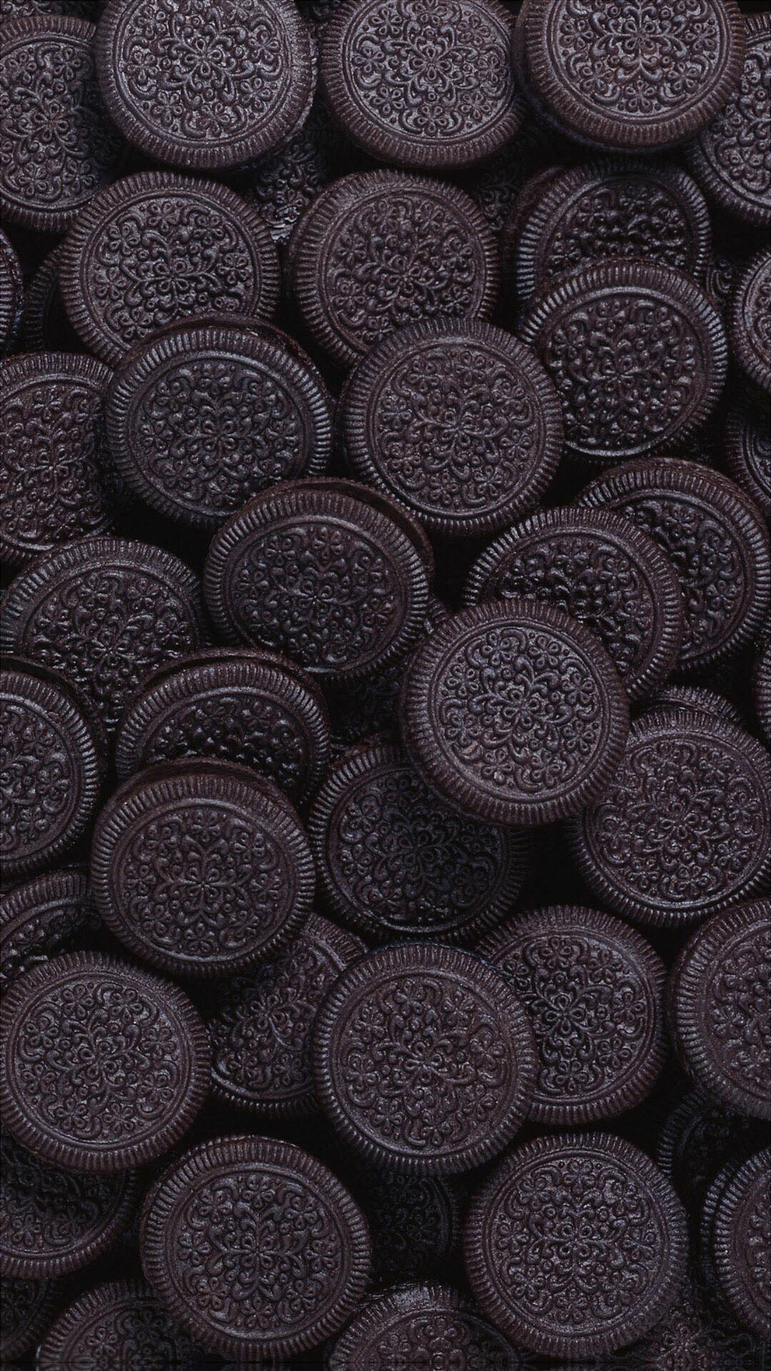 Sweets: Oreo, Sandwich cookie consisting of two biscuits with a sweet filling. 1080x1920 Full HD Background.