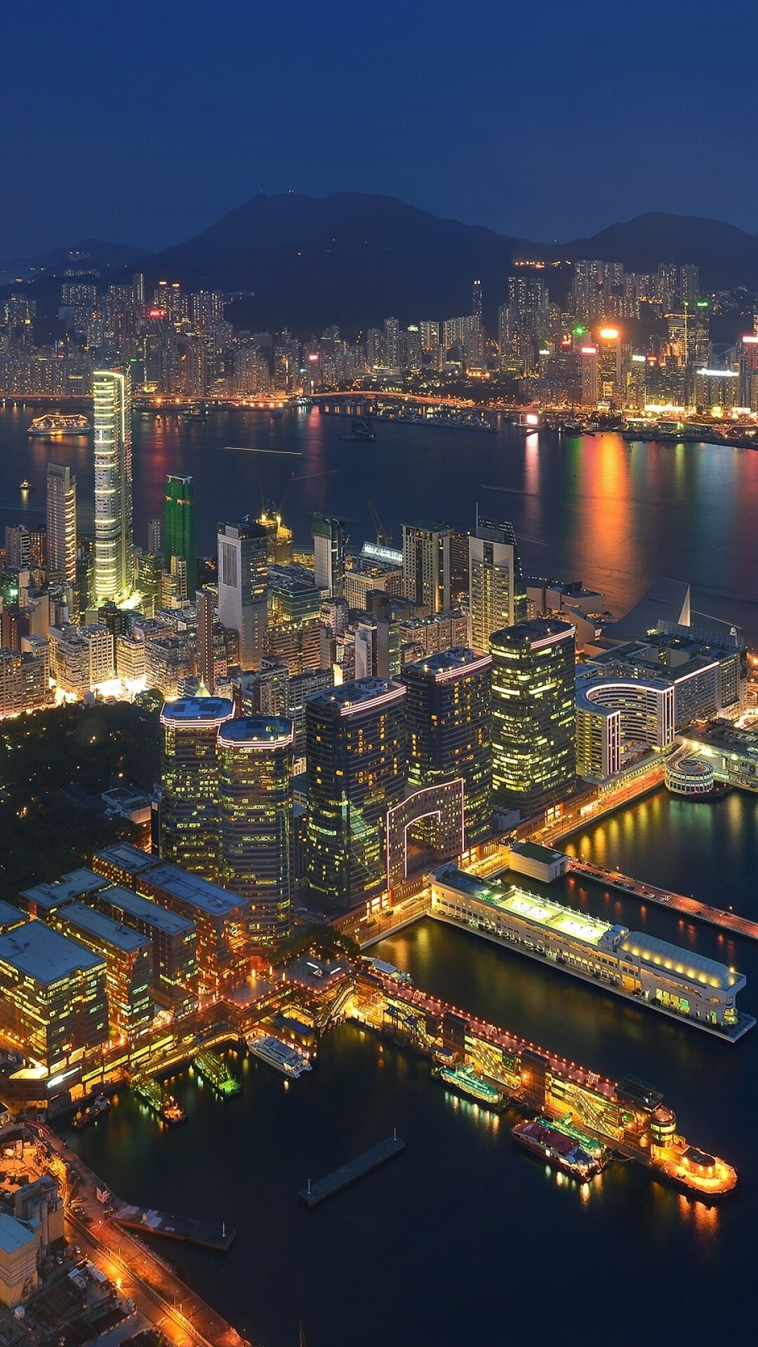 Hong Kong: Tsim Sha Tsui waterfront, Victoria Harbour from Sky100. 1080x1920 Full HD Background.