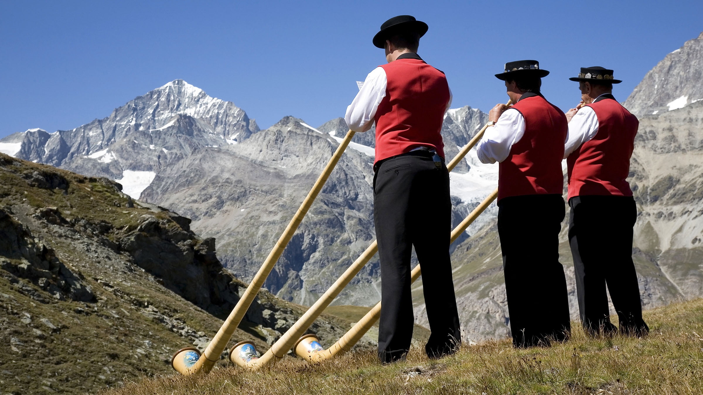 Alphorn: Swiss customs and traditions, Alphornists, Instruments carved from solid softwood. 2400x1350 HD Background.
