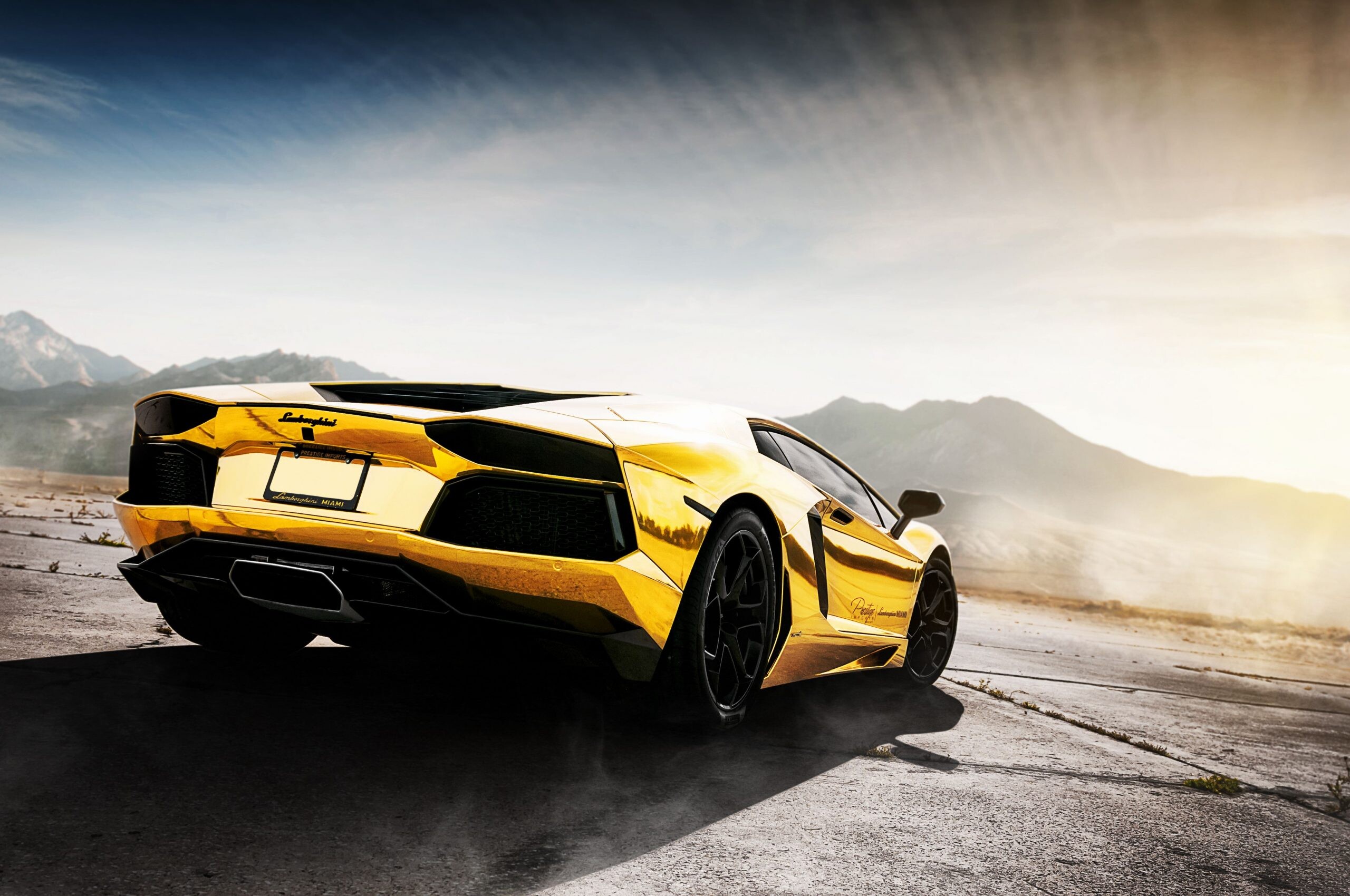 Gold Lamborghini: A mid-engine sports car covered with thin sheets of precious metal, Aventador LP 700. 2560x1700 HD Background.