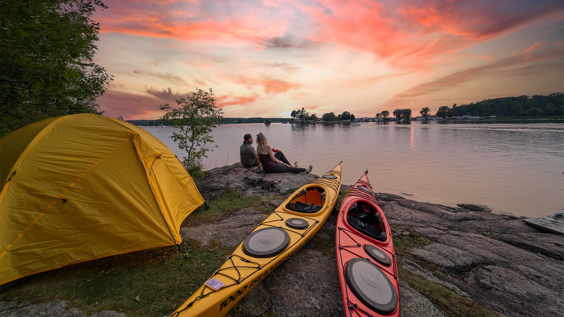 Kayaking: Couple resting during an extended recreational water trip to Thousand Islands in Canada. 1920x1080 Full HD Background.