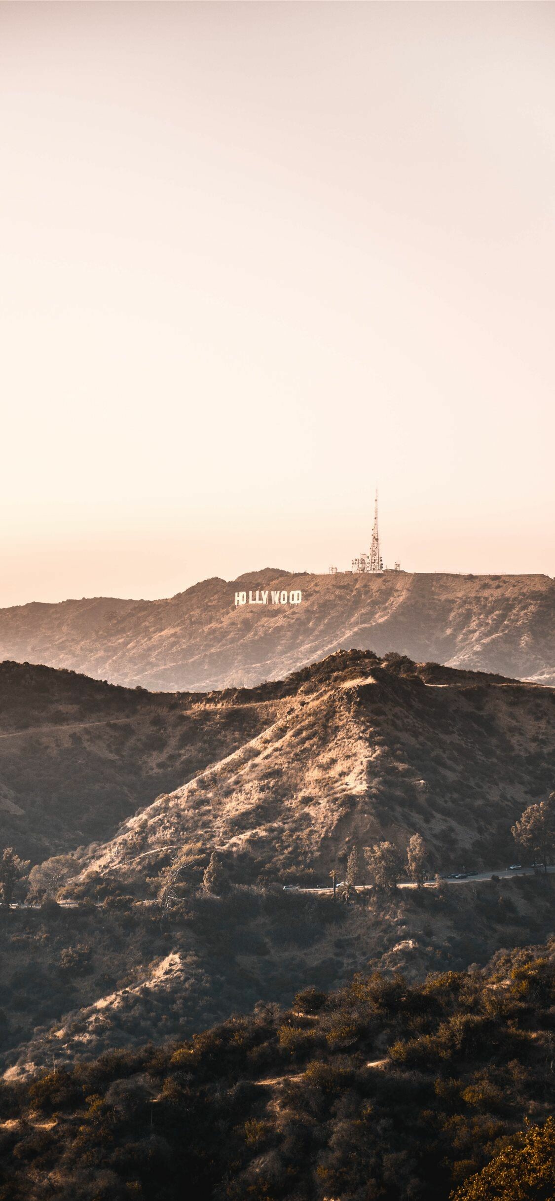 Hollywood Sign: The landmark was erected in 1923 and originally read “HOLLYWOODLAND”. 1130x2440 HD Wallpaper.