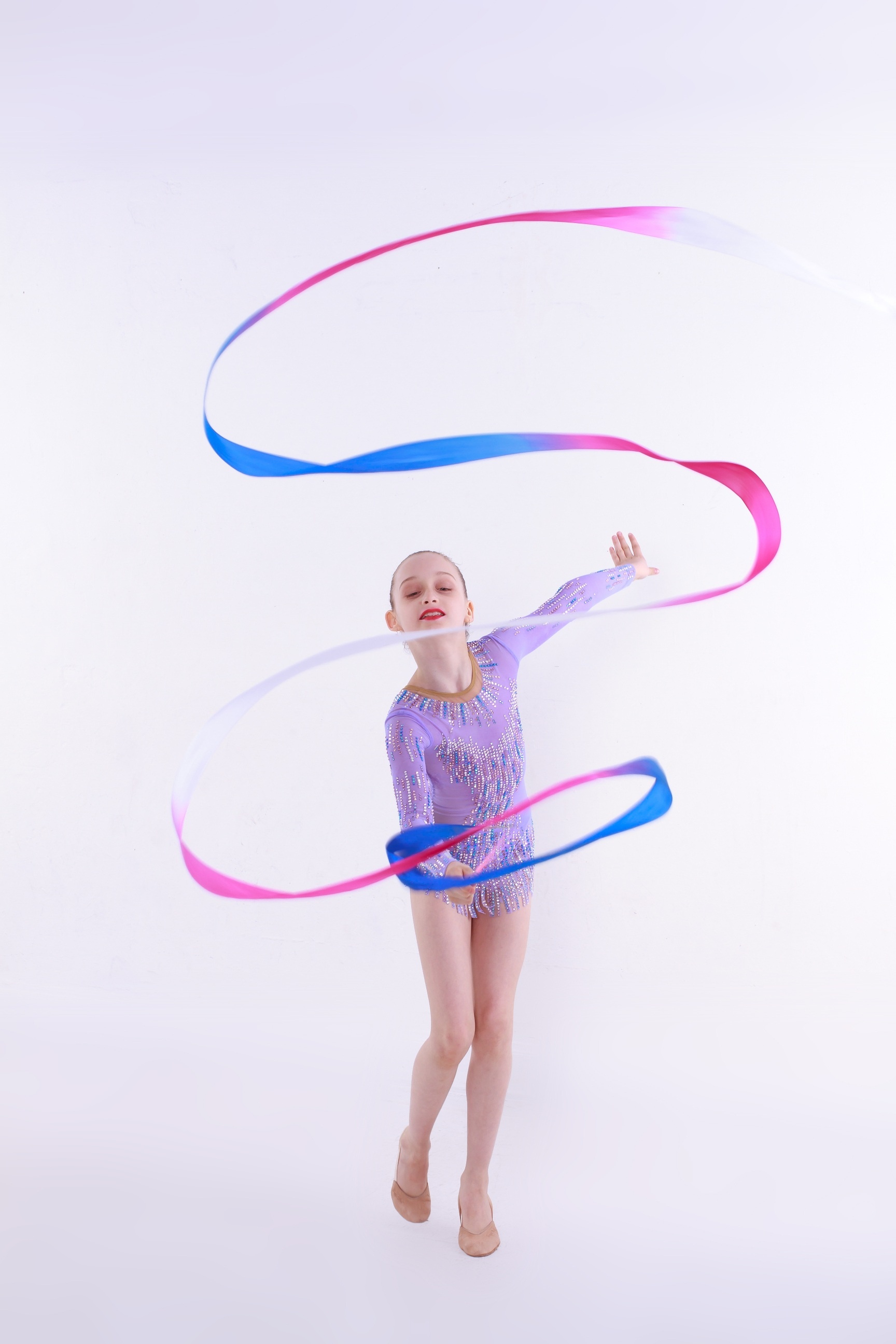 Rhythmic Gymnastics: A young gymnast with a ribbon, Artistic sports performance. 1730x2600 HD Background.