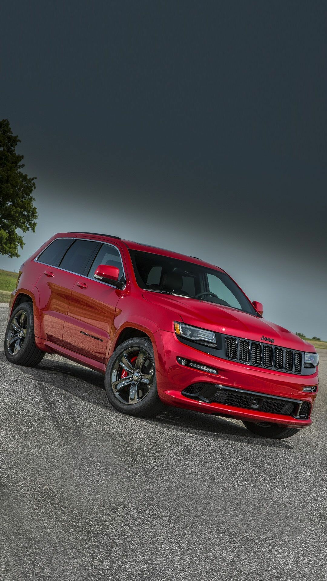 Jeep Grand Cherokee: SRT trim, Wears more aggressive bodywork and comes standard with a sport-tuned suspension and upgraded brakes. 1080x1920 Full HD Background.