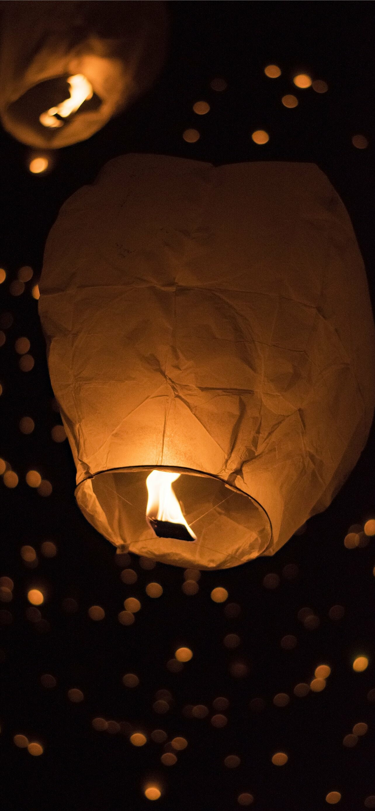 Lantern Festival: The lanterns symbolizing the people letting go of their past selves and getting new ones. 1290x2780 HD Wallpaper.