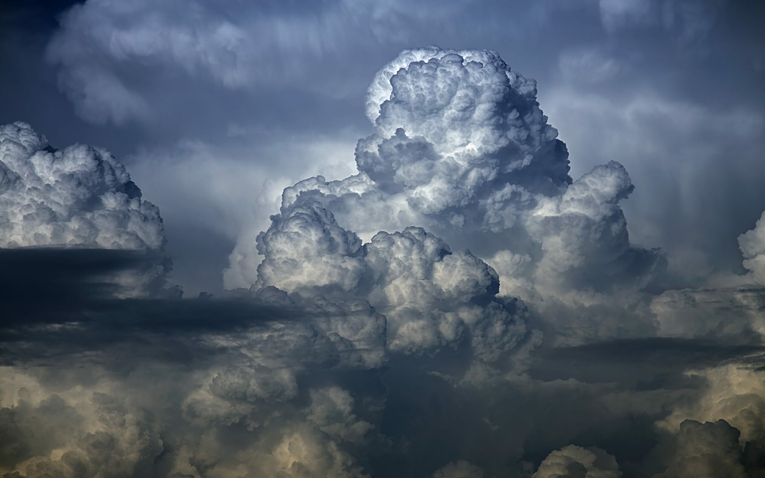 Clouds: Cumulonimbus type has fuzzy outlines at the upper parts that sometimes include anvil tops. 2560x1600 HD Background.
