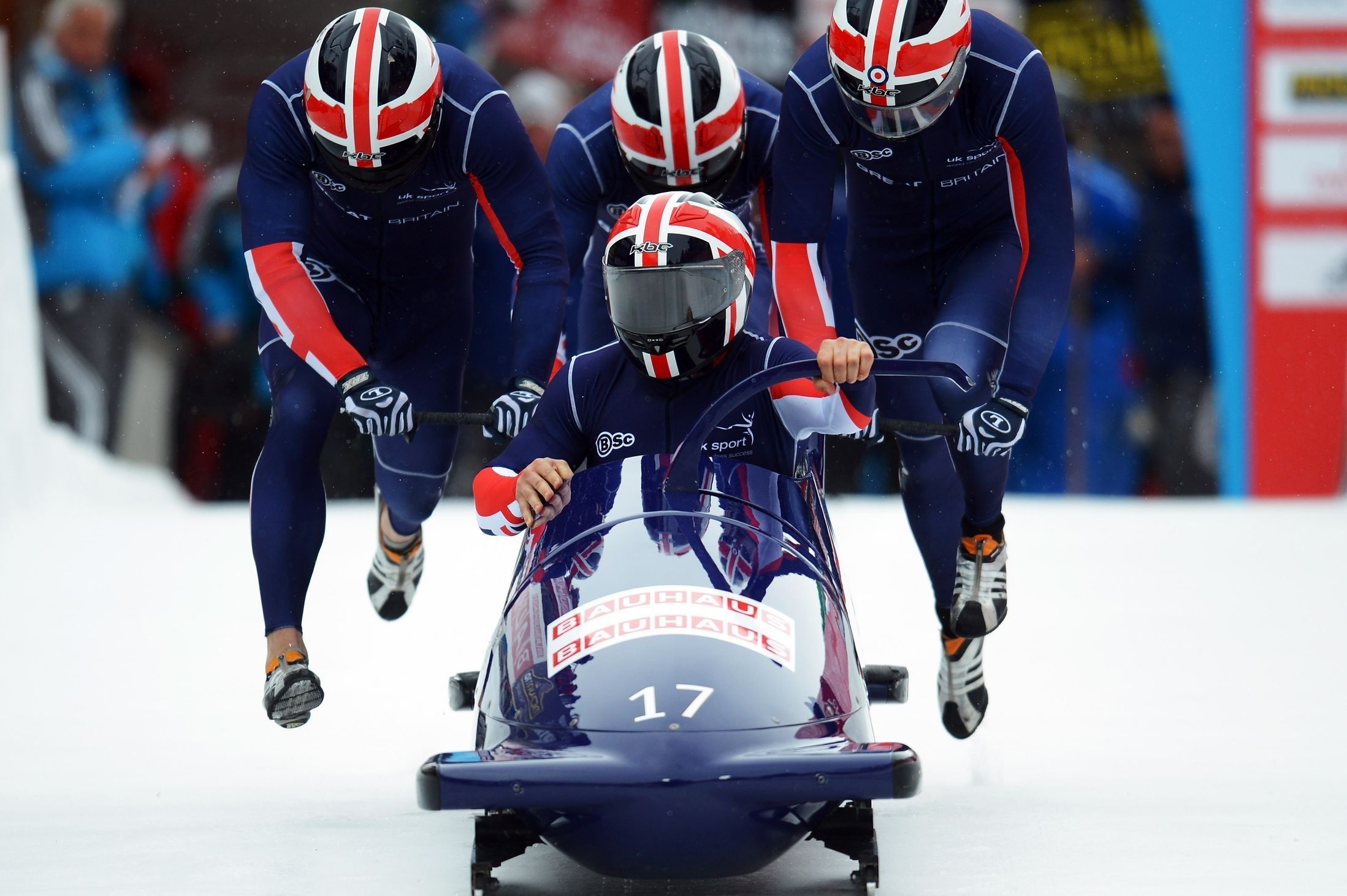 Bobsleigh: A team winter sport that involves making timed runs down narrow, twisting, banked, iced tracks. 2200x1470 HD Background.