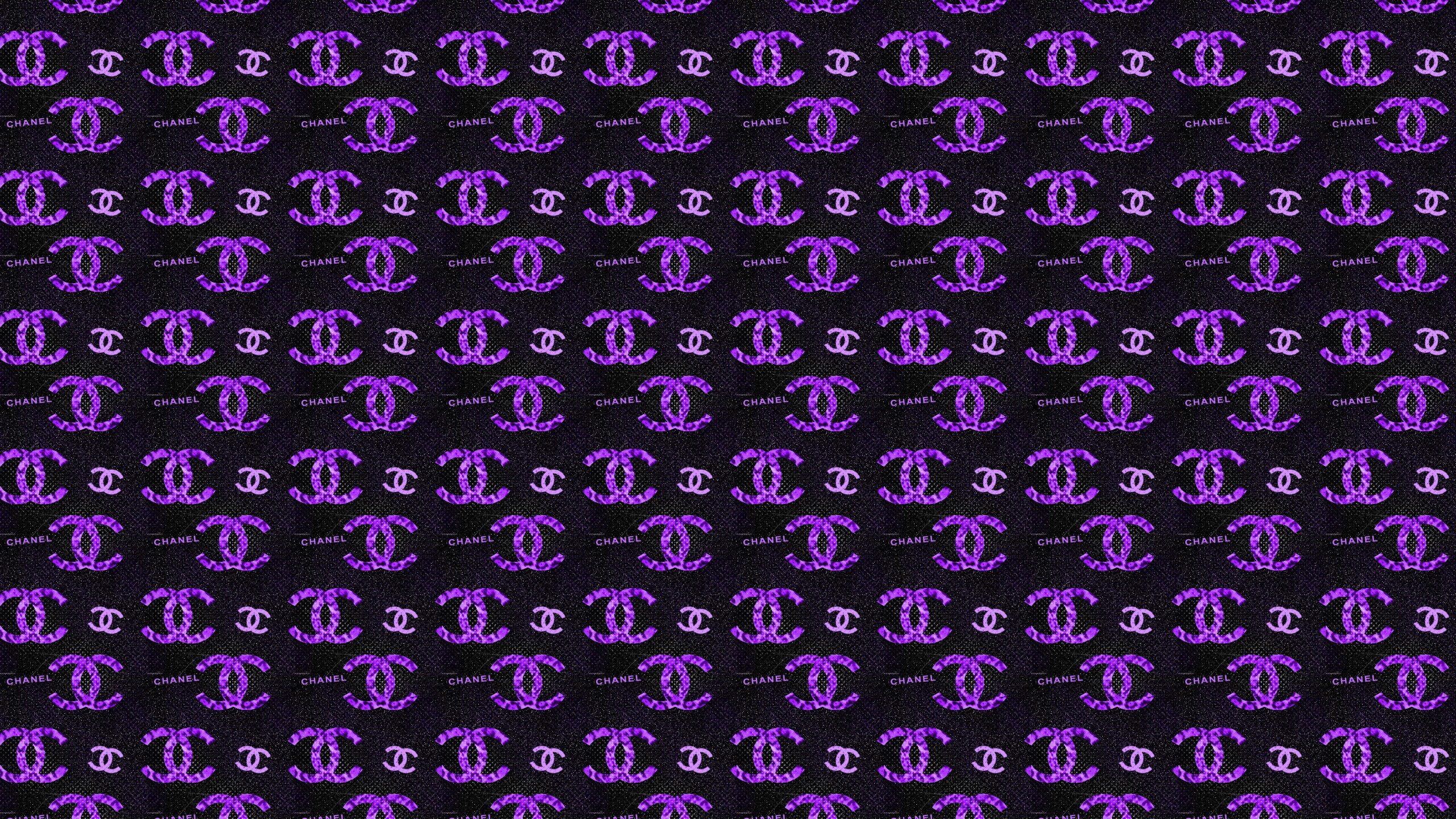 Chanel: A private company and a world leader in creating, developing, manufacturing, and distributing luxury products. 2560x1440 HD Background.