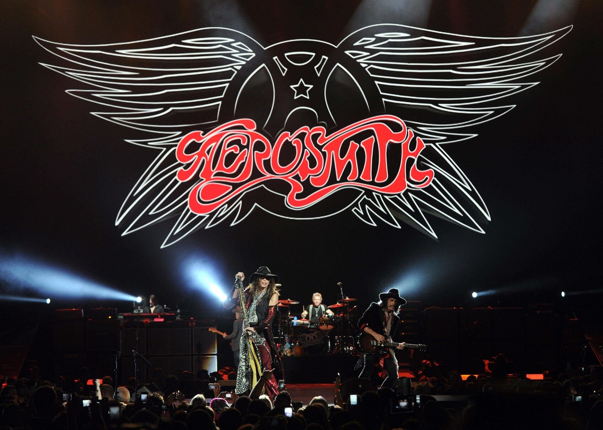 Aerosmith: Drug addiction and internal conflict led to the departures of Perry and Whitford in 1979 and 1981. 1920x1370 HD Background.