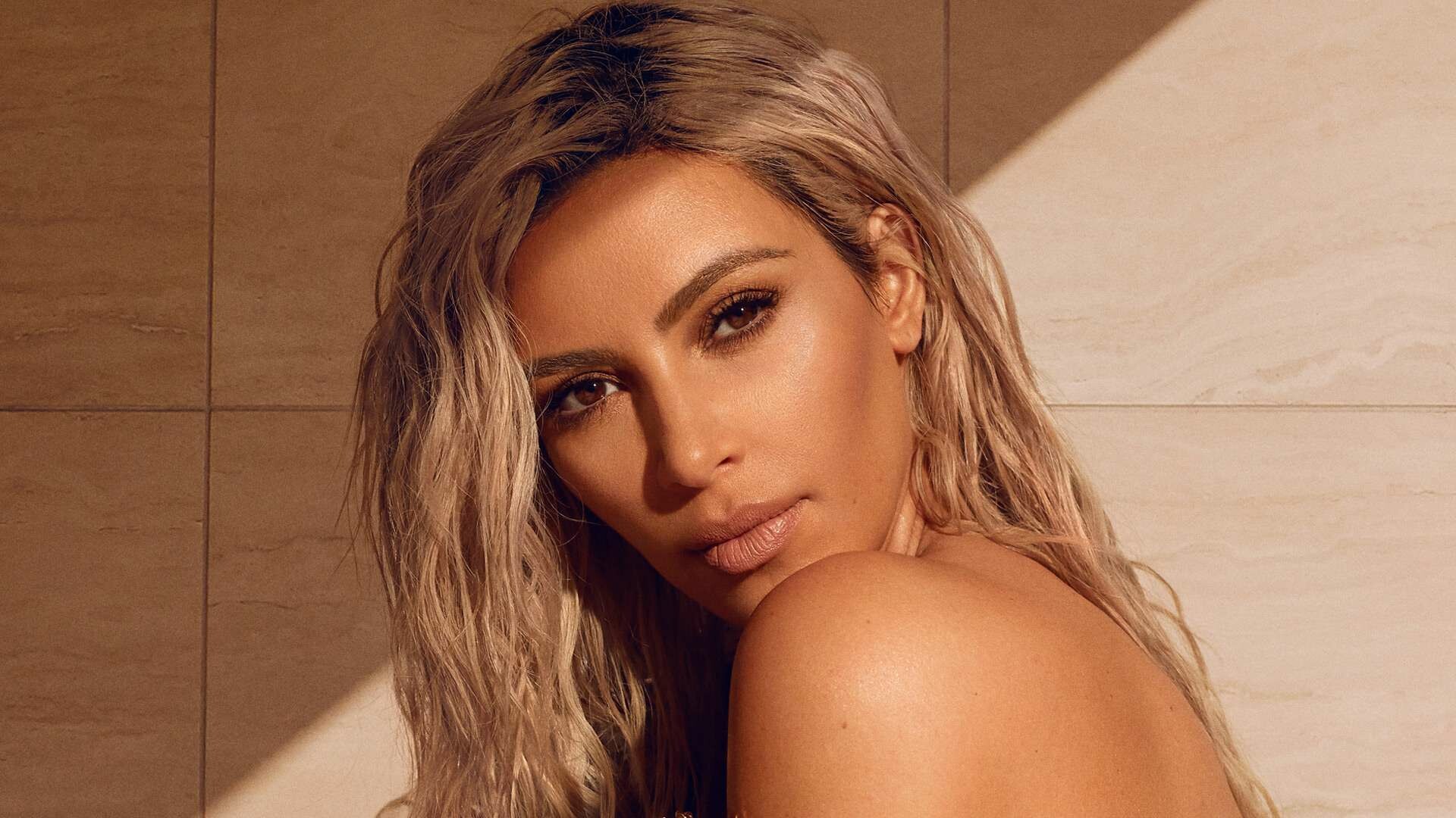 Kim Kardashian: A businesswoman and media personality who expanded her brand into fashion, fragrance, and beauty products. 1920x1080 Full HD Wallpaper.