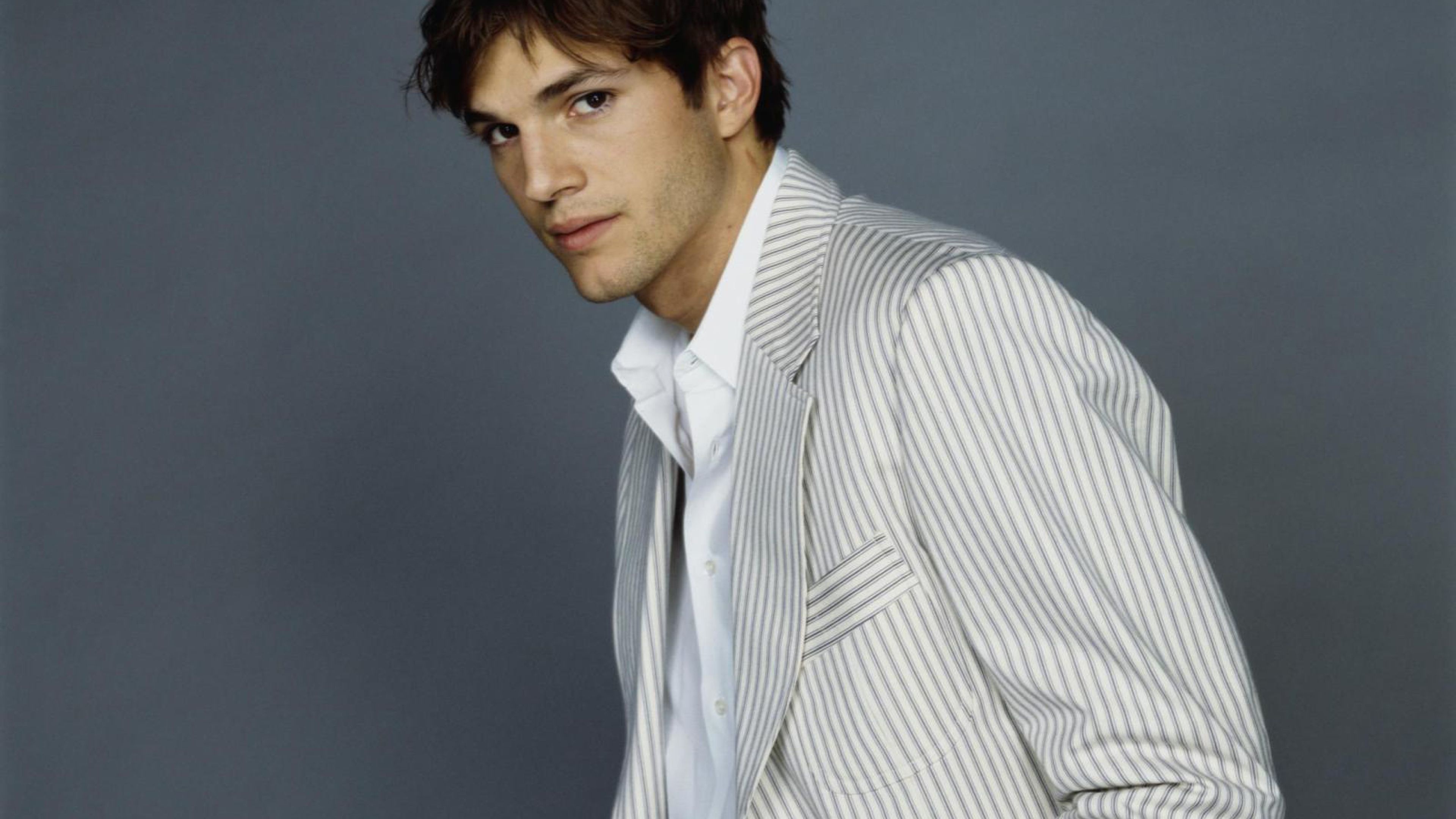 Ashton Kutcher and Mila Kunis: An American actor, producer, entrepreneur, and former model. 3840x2160 4K Background.