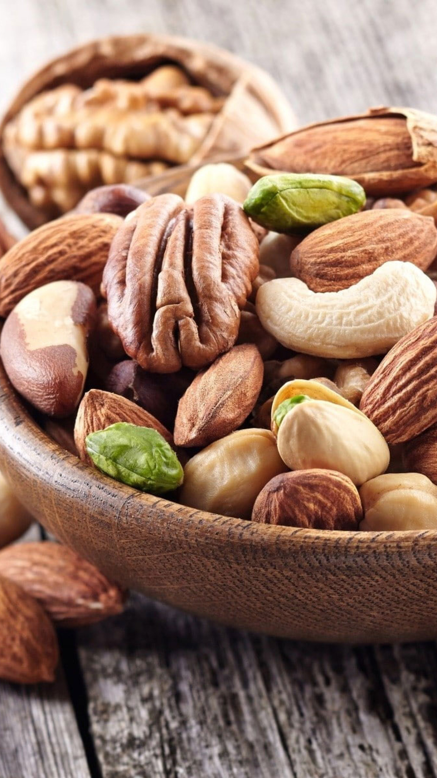 Nuts: Raw food, packed with vitamins, minerals, protein and good fats. 1440x2560 HD Background.