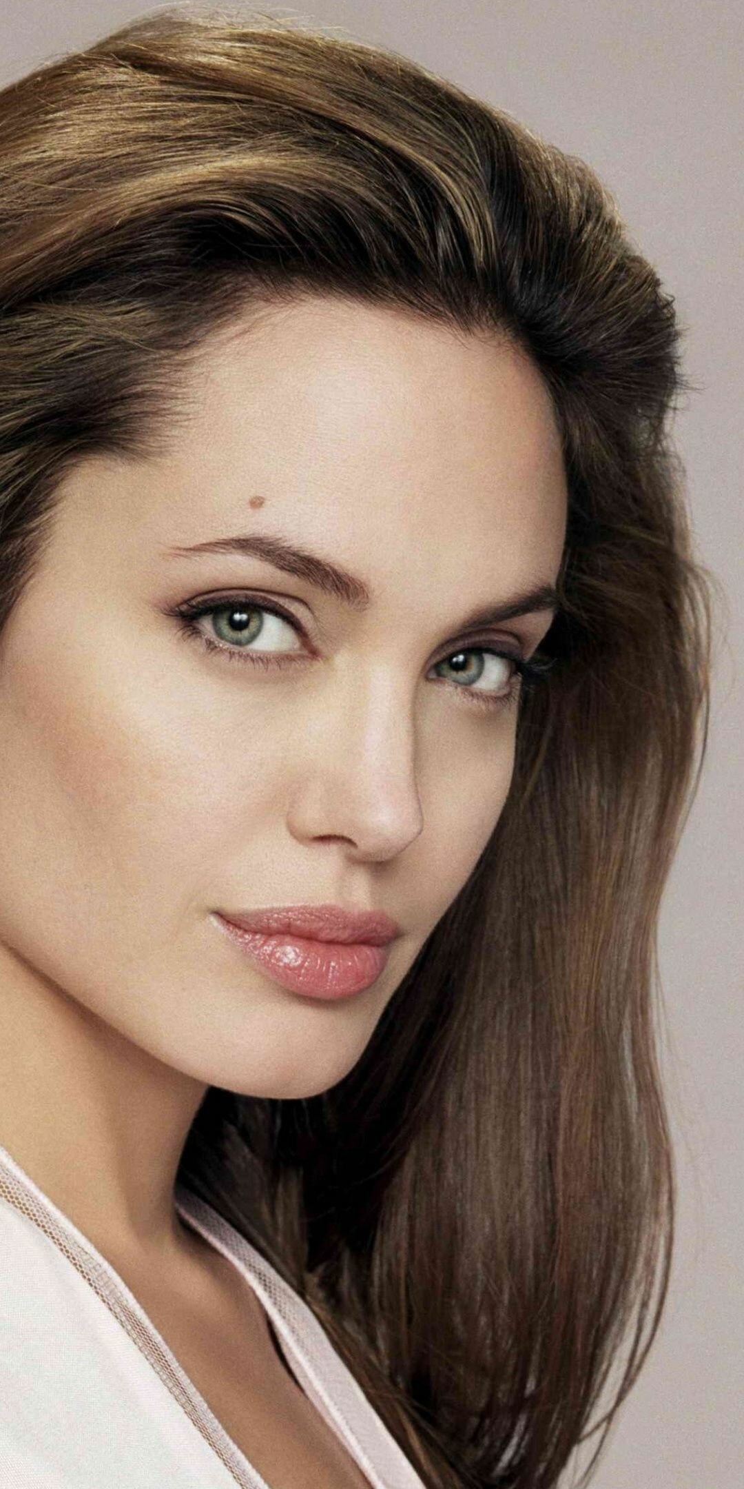 Angelina Jolie: Studied drama at New York University. 1080x2160 HD Wallpaper.