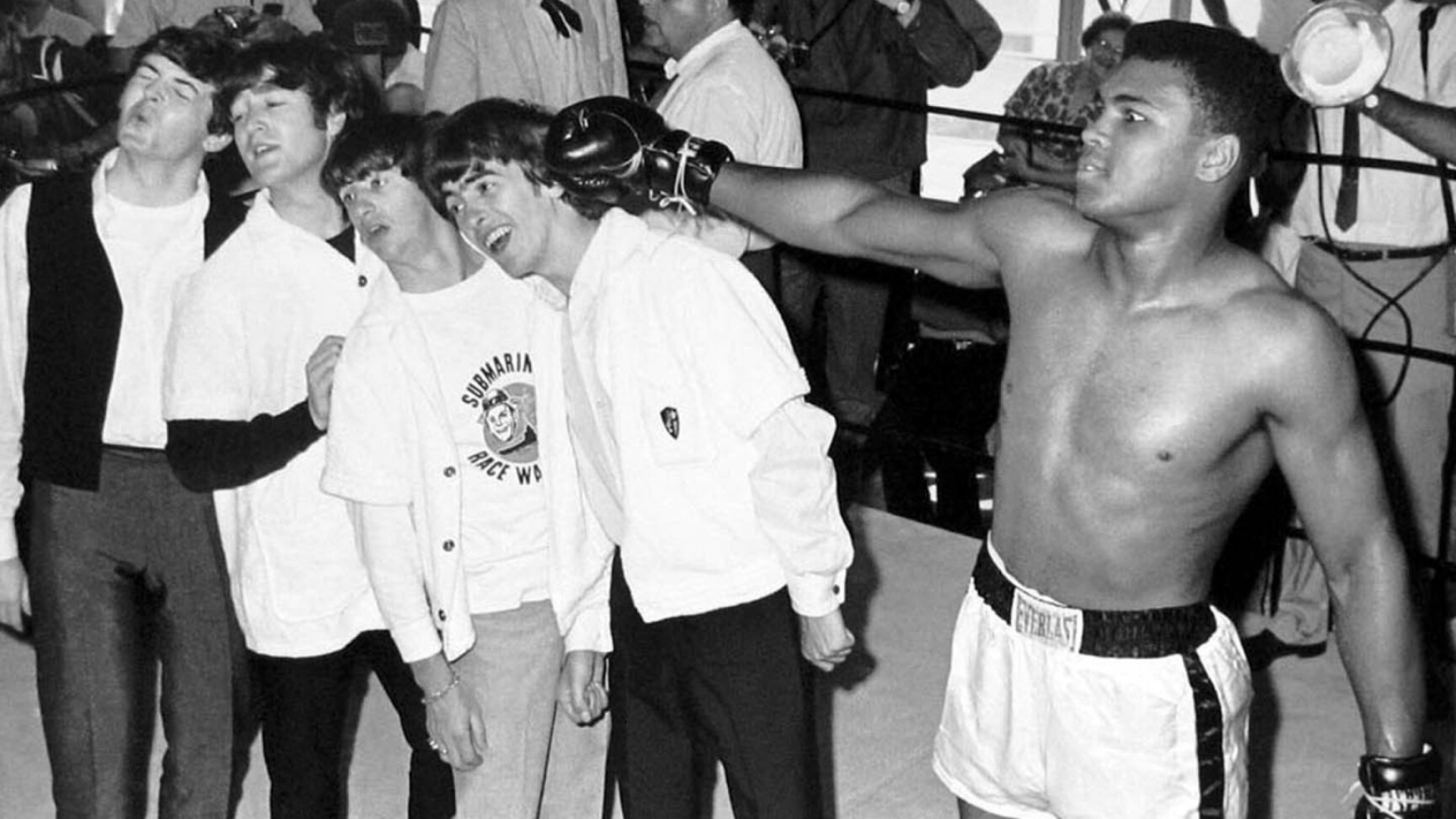 Muhammad Ali: The Beatles, Ken Norton broke his jaw while giving him the second loss of his career in 1973. 1920x1080 Full HD Background.
