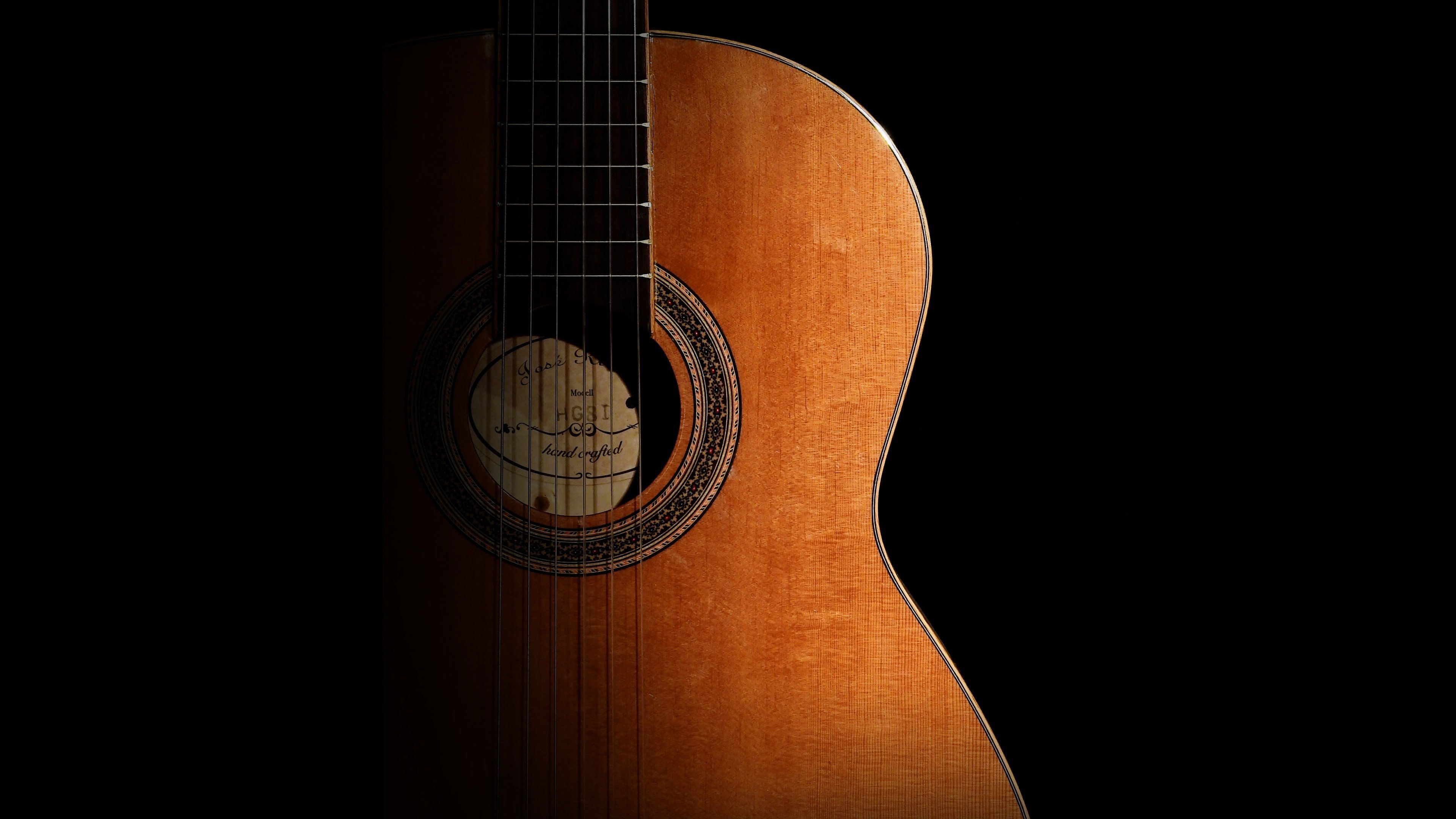 Guitar: A stringed musical instrument played by plucking or strumming with the fingers or a plectrum. 3840x2160 4K Wallpaper.