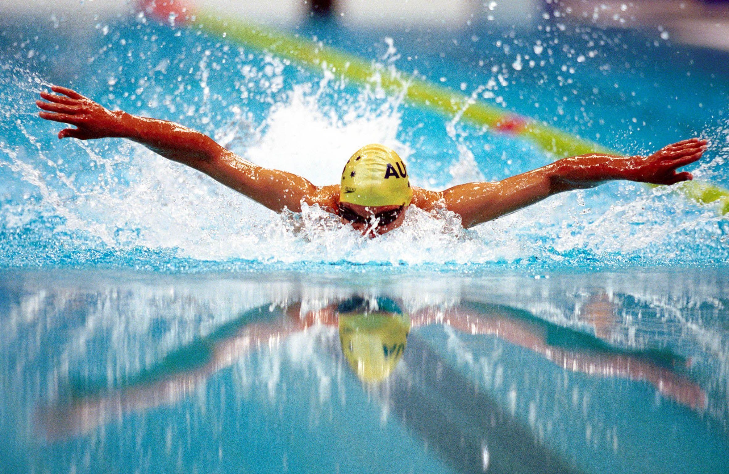 Swimming: A butterfly swimming stroke, A popular water sports style of an advanced level. 2370x1540 HD Background.