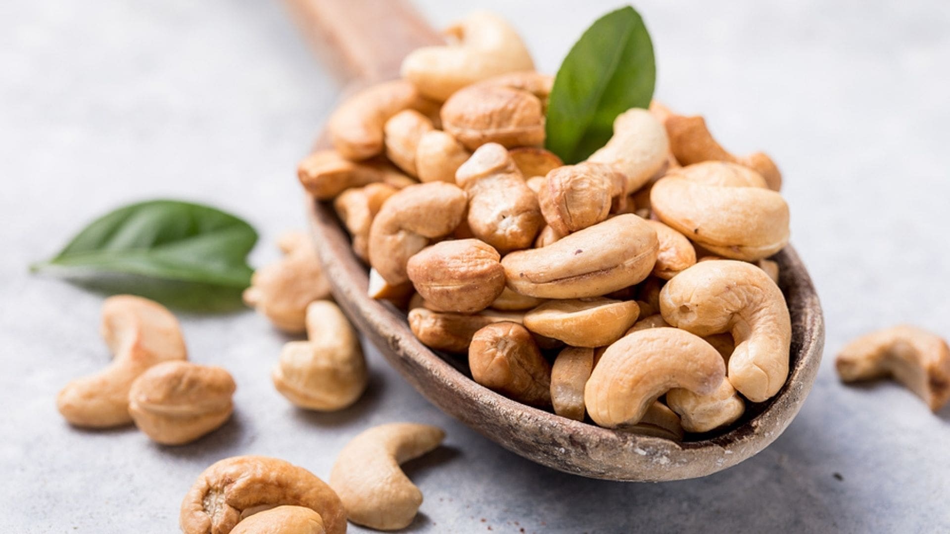 Cashew Nuts: High in monounsaturated and polyunsaturated fats, Popular international food. 1920x1080 Full HD Background.