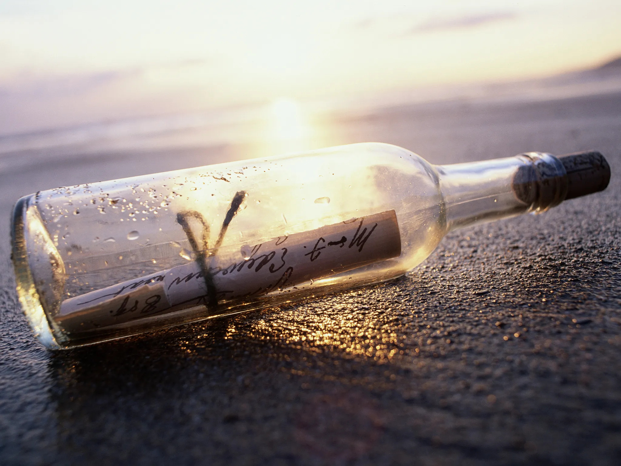Message in a Bottle: A symbol of hope and a way to connect with others, even across great distances. 2050x1540 HD Background.