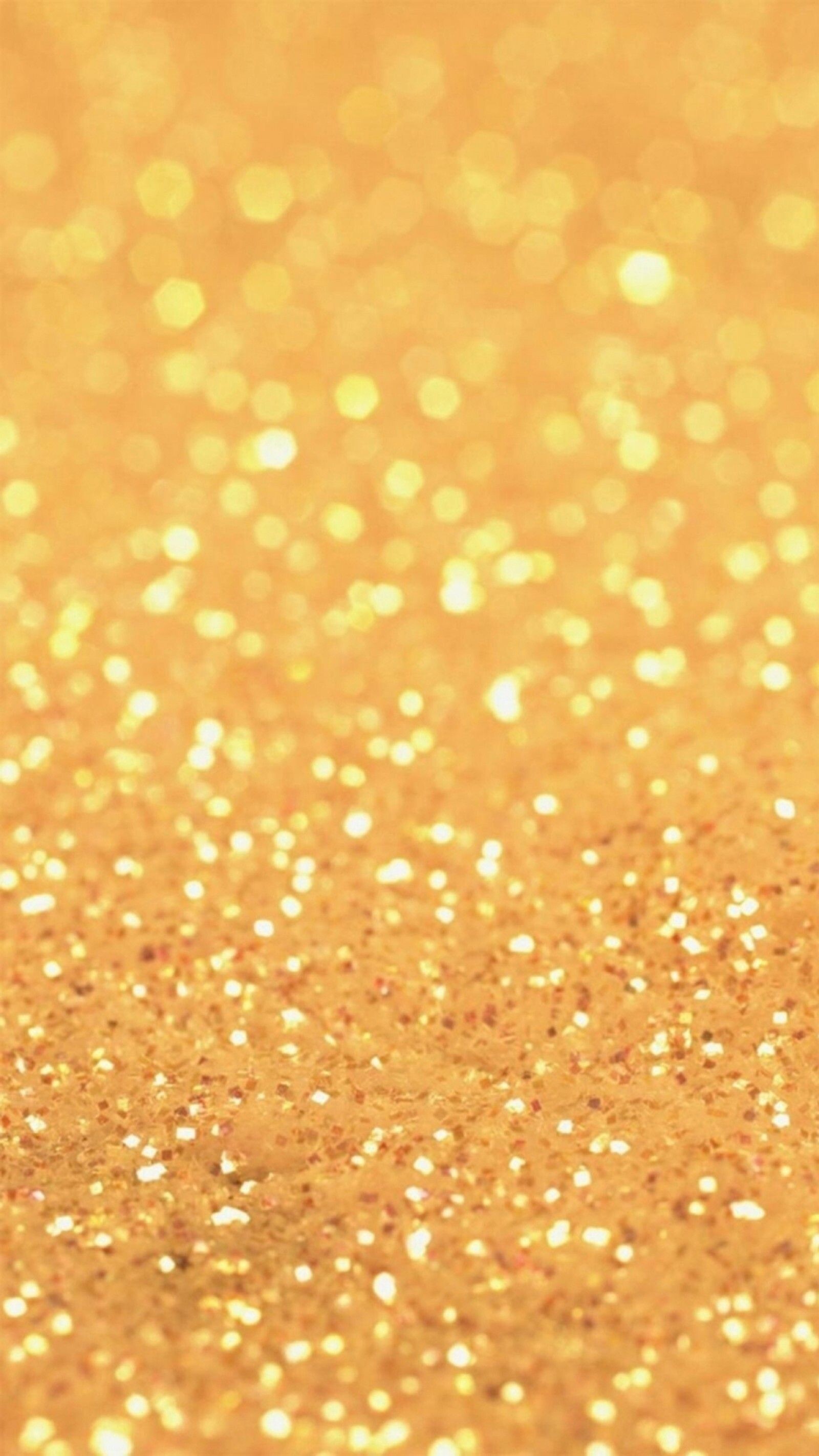 Gold Sparkle: Small particles with golden glittering surfaces, PVC cut into various shapes. 1600x2850 HD Background.