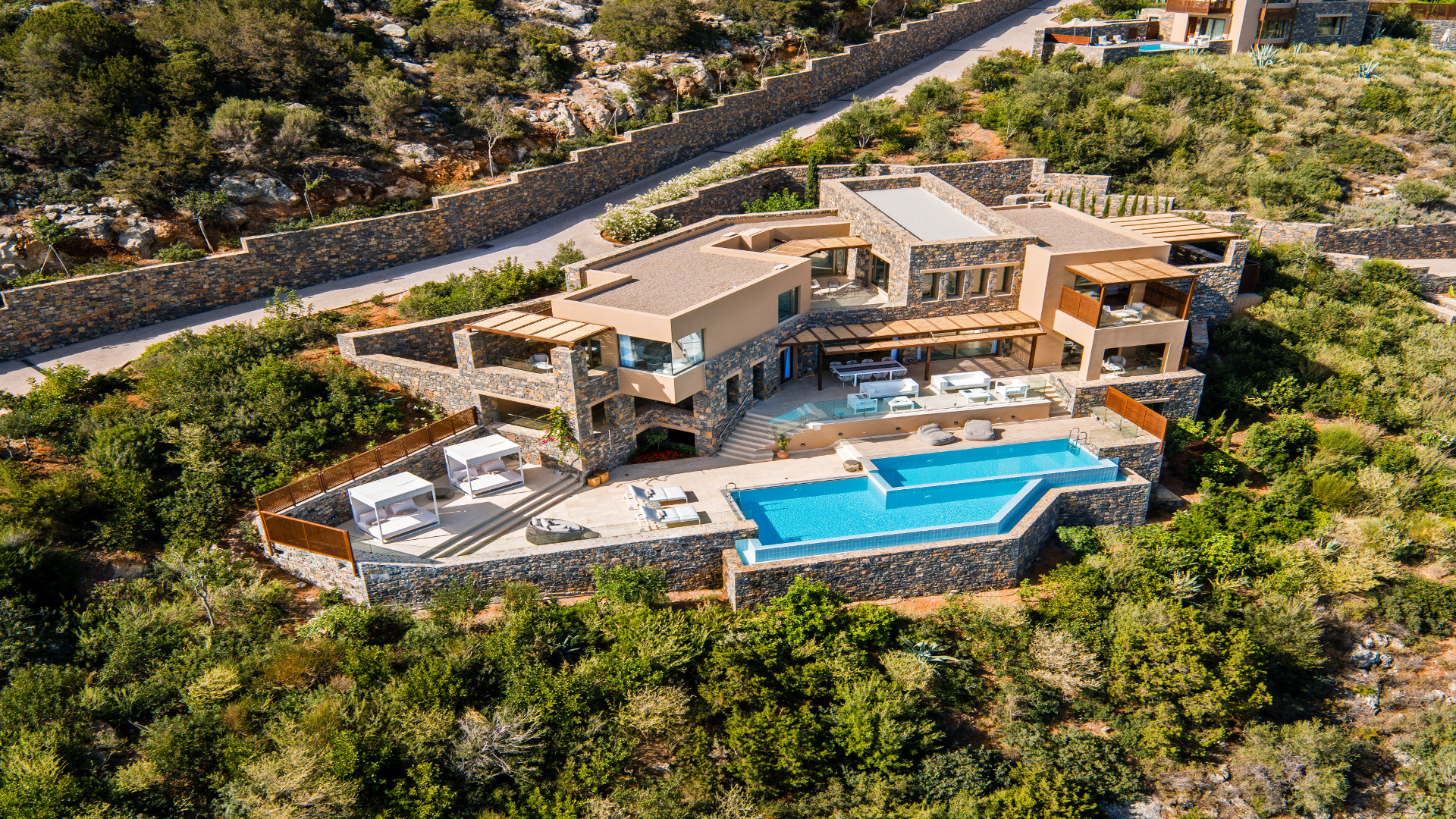 Mansion: Daios Residence, A secluded bay near Agios Nikolaos in Crete, Private villa. 1920x1080 Full HD Background.