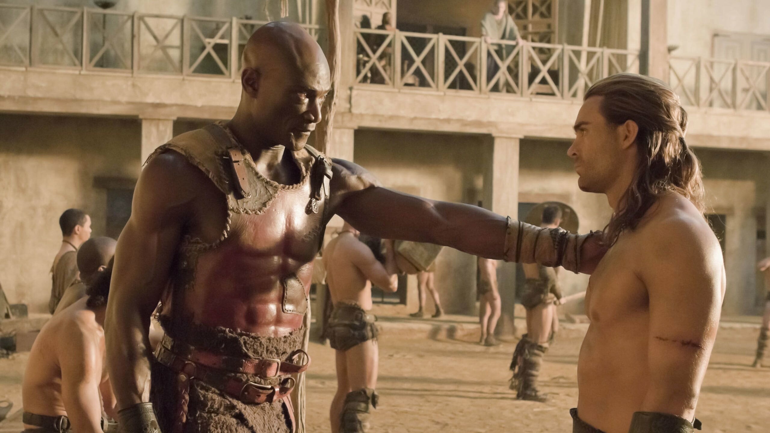 Spartacus: Gods of the Arena: Dustin Clare as Gannicus and Peter Mensah as Oenomaus/Doctore. 2560x1440 HD Background.