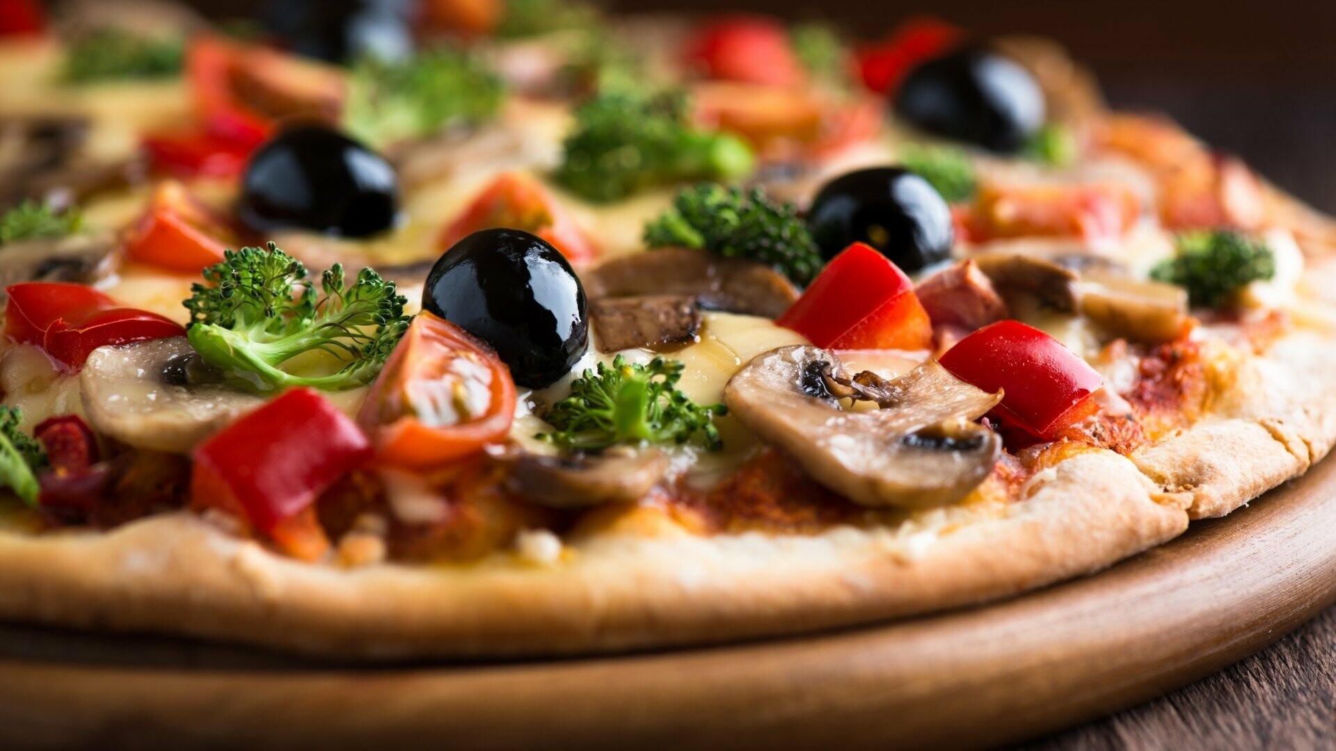 Pizza: Capricciosa, Tomato sauce, mushrooms, mozzarella cheese, black olives, ham. 1920x1080 Full HD Background.