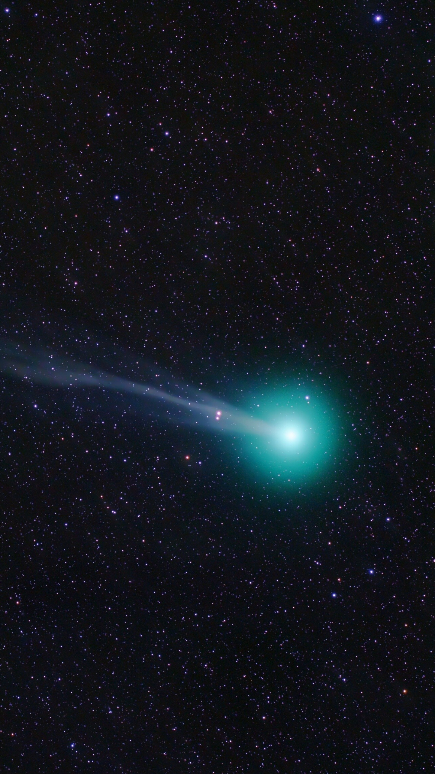 Comet: Distinguished from asteroids by the presence of an extended, gravitationally unbound atmosphere. 1440x2560 HD Background.