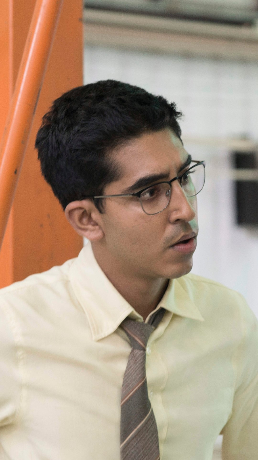 Chappie: Dev Patel as Deon Wilson, a programmer at Tetravaal. 1080x1920 Full HD Wallpaper.
