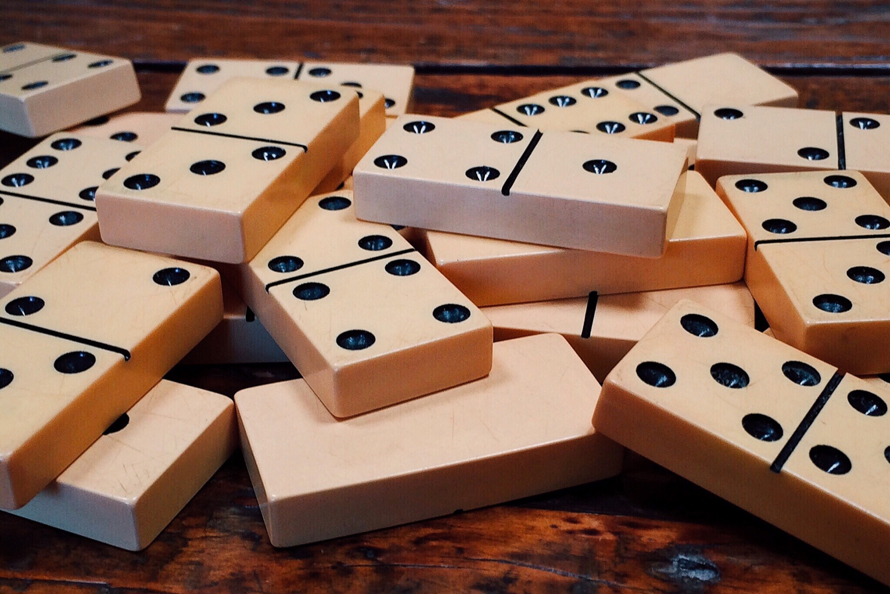 Dominoes: Small game blocks on a wooden table, A popular competitive game. 3120x2090 HD Wallpaper.