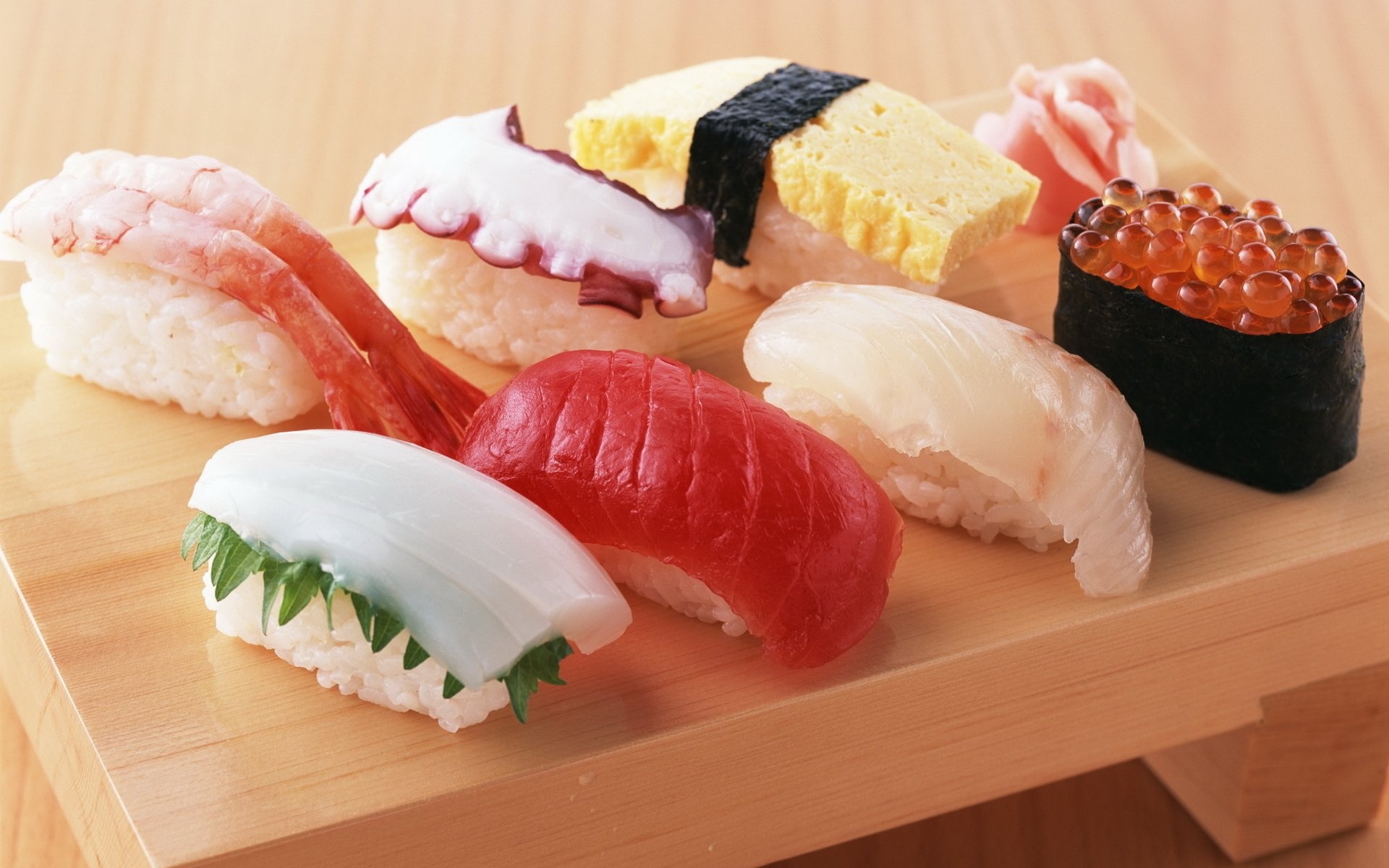 Sushi: Rice topped with wasabi and a filet of raw or cooked fish or shellfish, Nigiri. 1920x1200 HD Background.