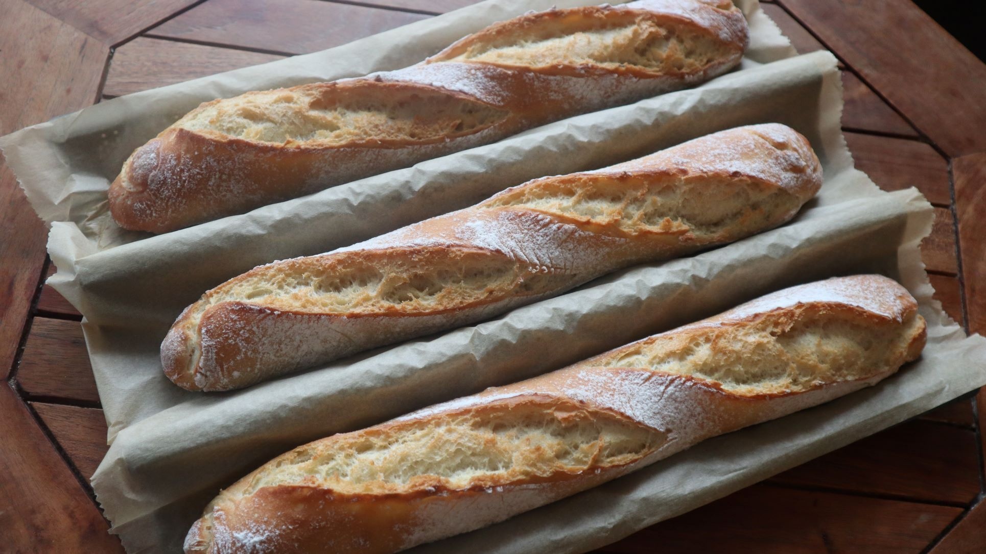 Baguette: A variety of bread that is long and narrow in shape. 1930x1090 HD Background.