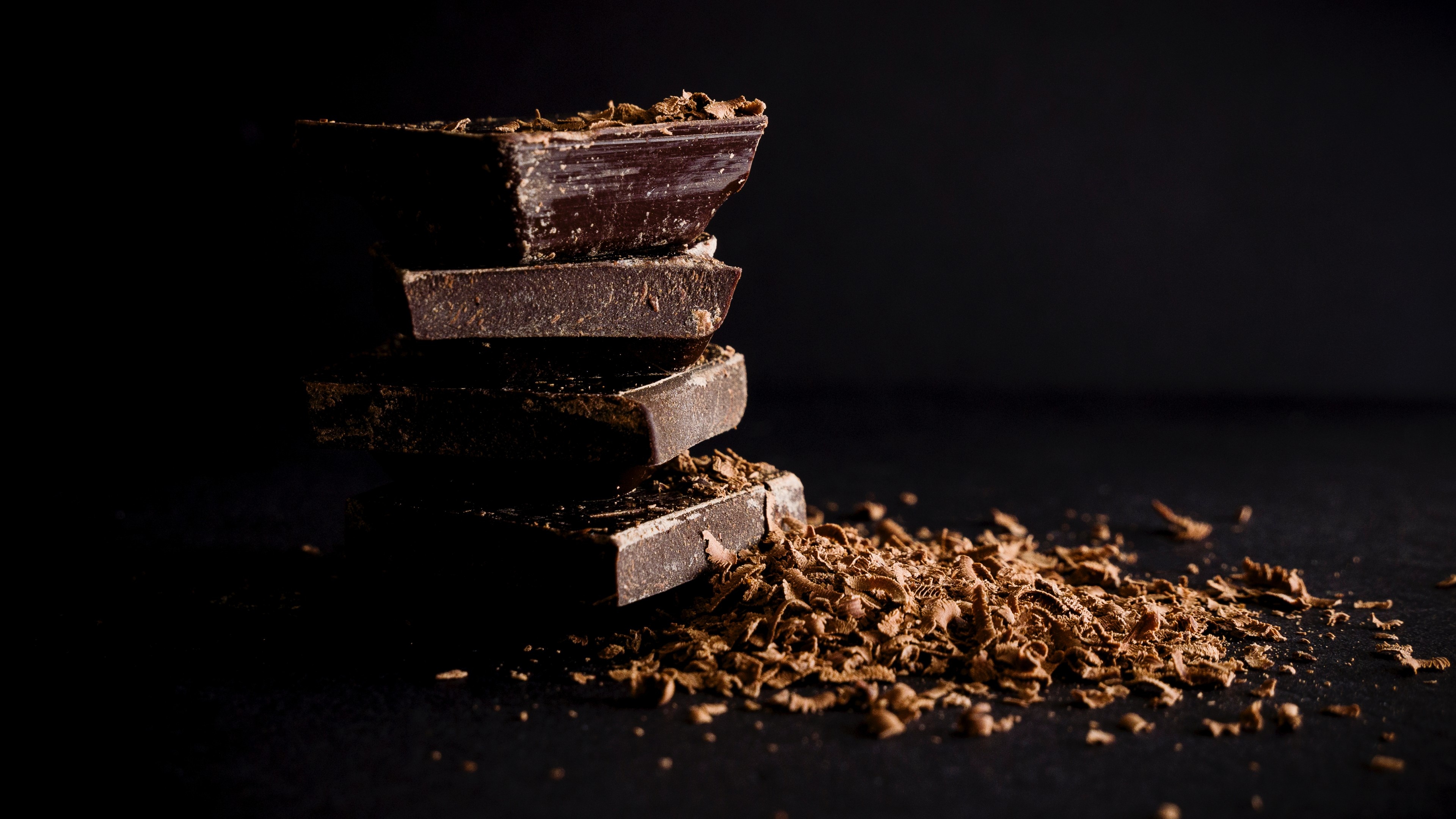 Chocolate: Used in many desserts like pudding, cakes, candy, ice cream. 3840x2160 4K Background.
