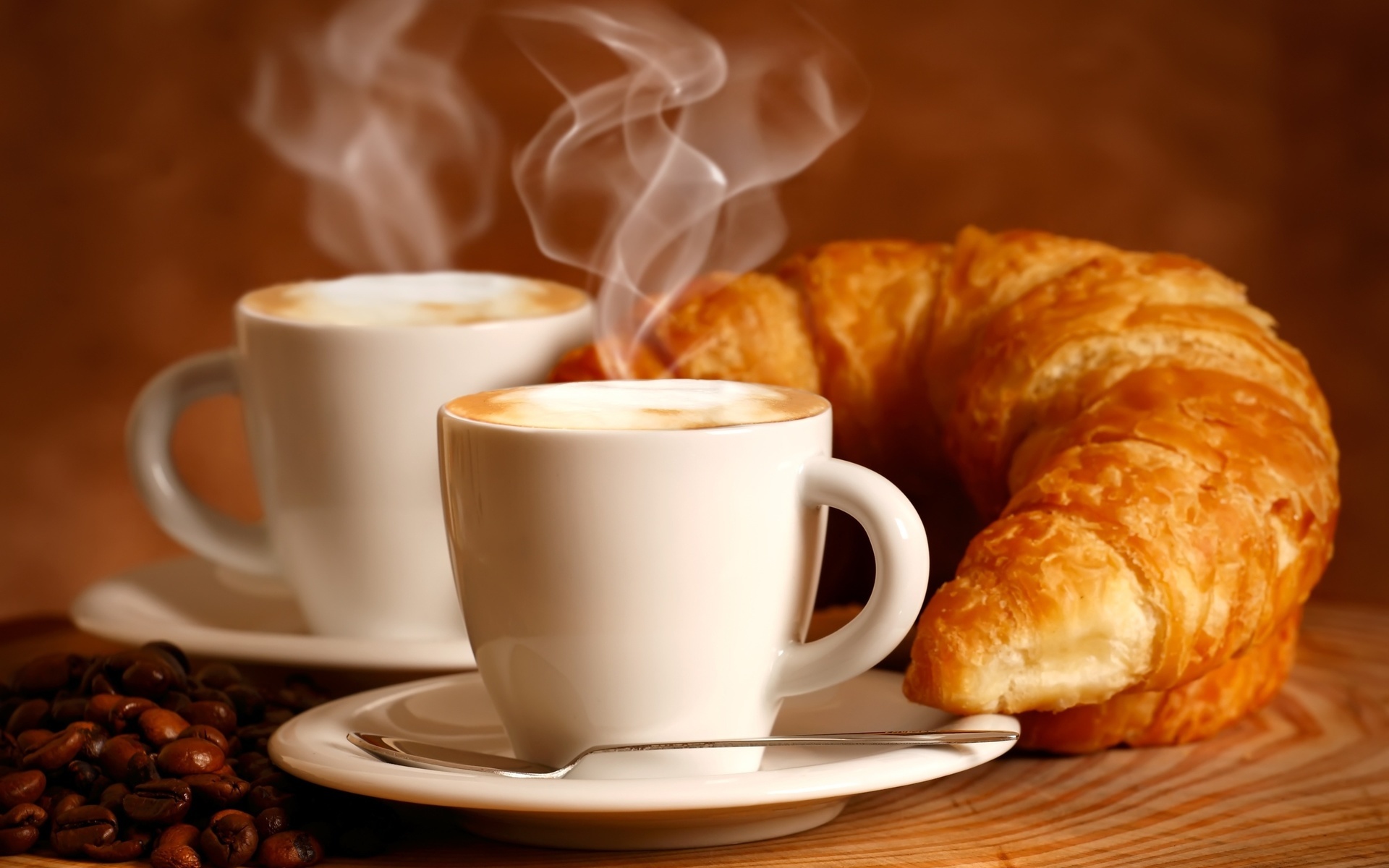 Croissant: Paired with a hot beverage such as cappuccino or tea. 1920x1200 HD Wallpaper.