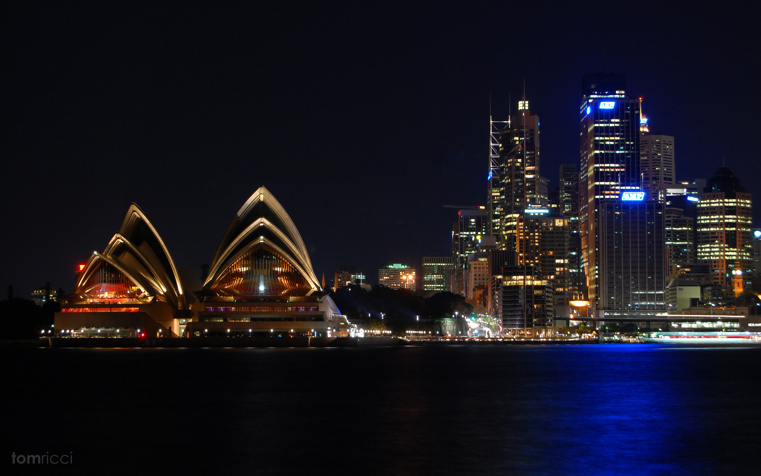 Sydney: Opera House, was designated a UNESCO World Heritage site in 2007. 2560x1600 HD Background.
