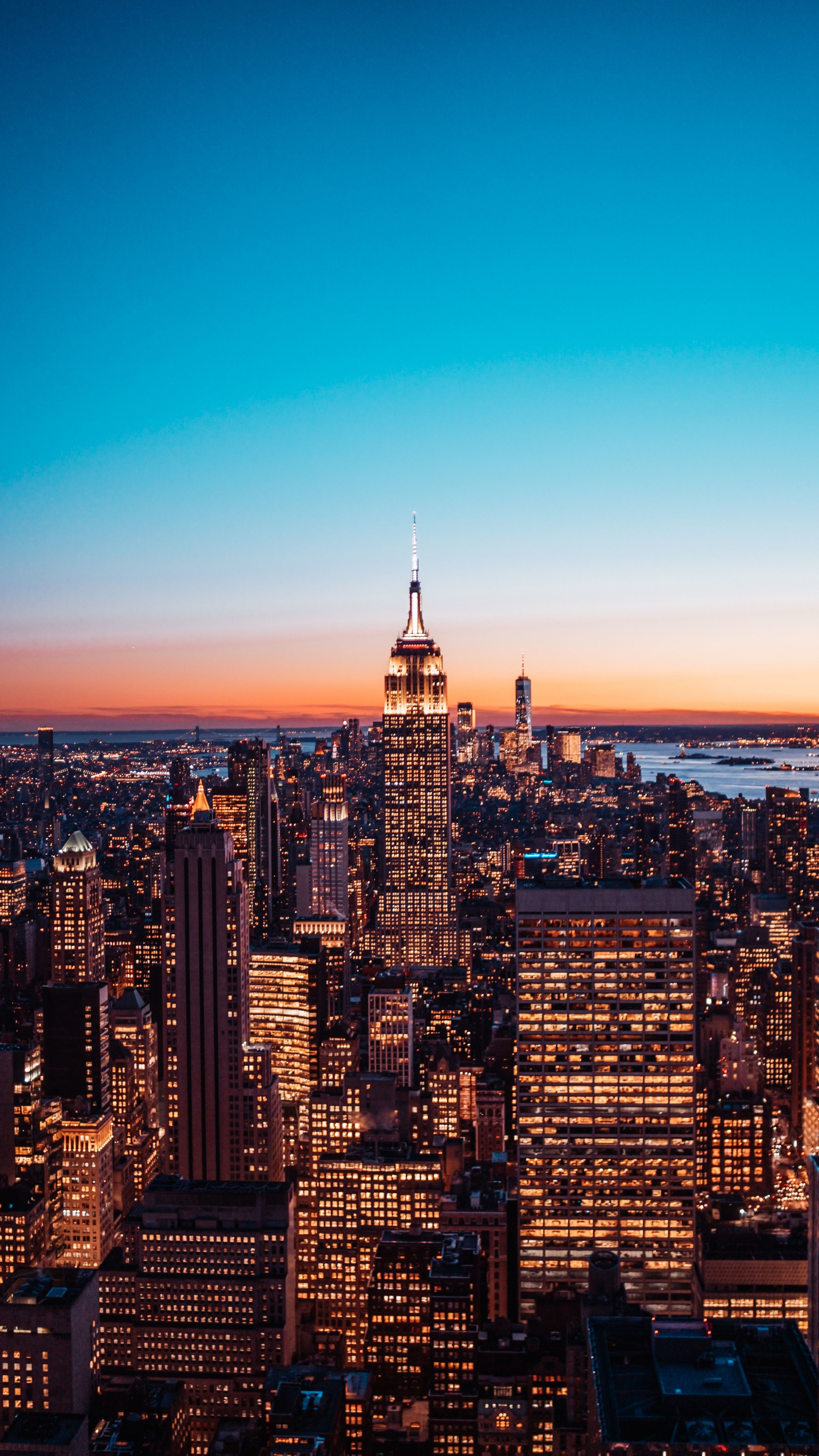 Skyline: The lights of Manhattan at dusk time, Empire State Building, New York City. 2160x3840 4K Wallpaper.