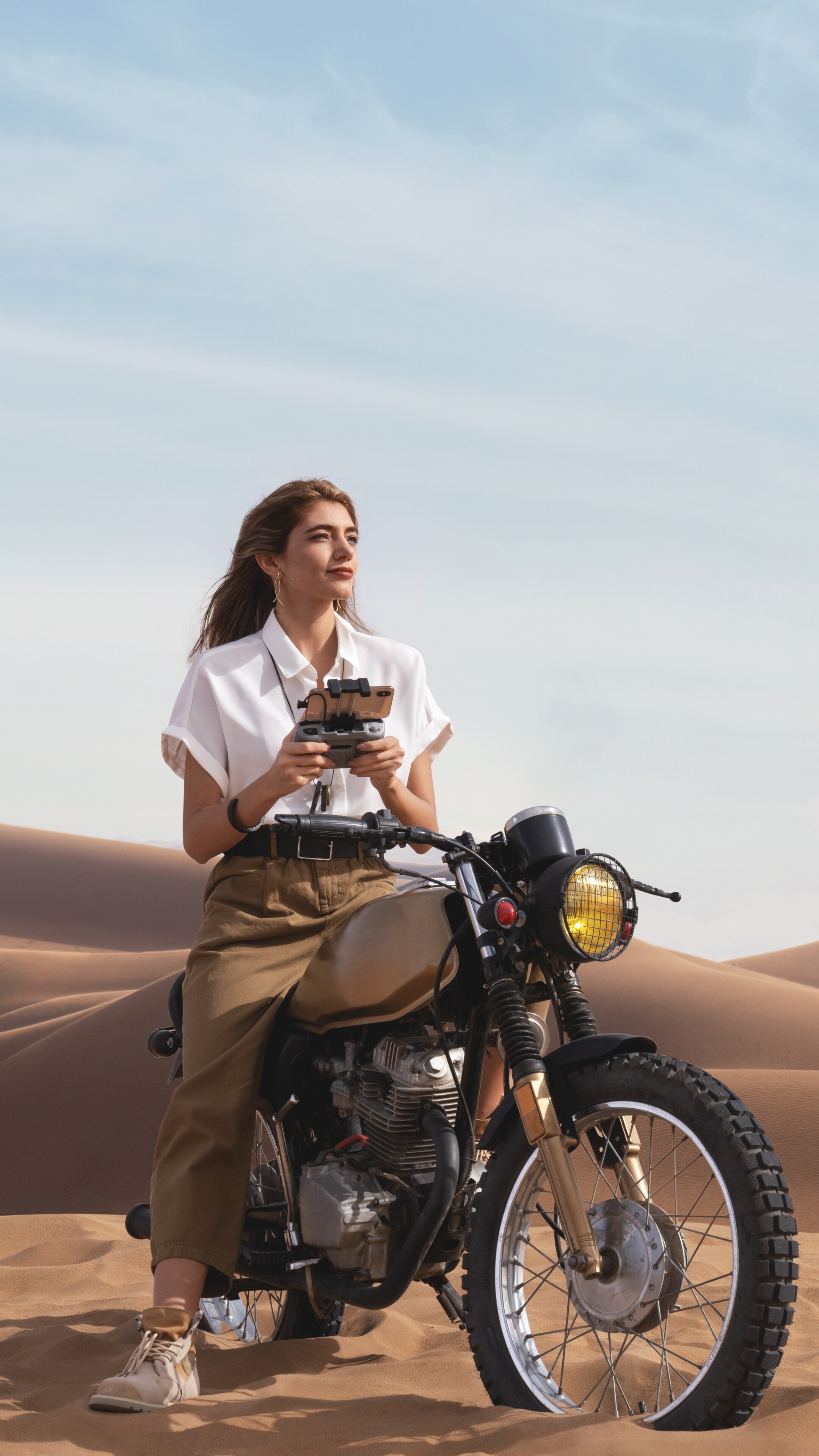 Girls and Motorcycles: Riding in sand dunes, Hot weather riding, Lightweight motorcycles, Female motorcyclist. 2160x3840 4K Wallpaper.