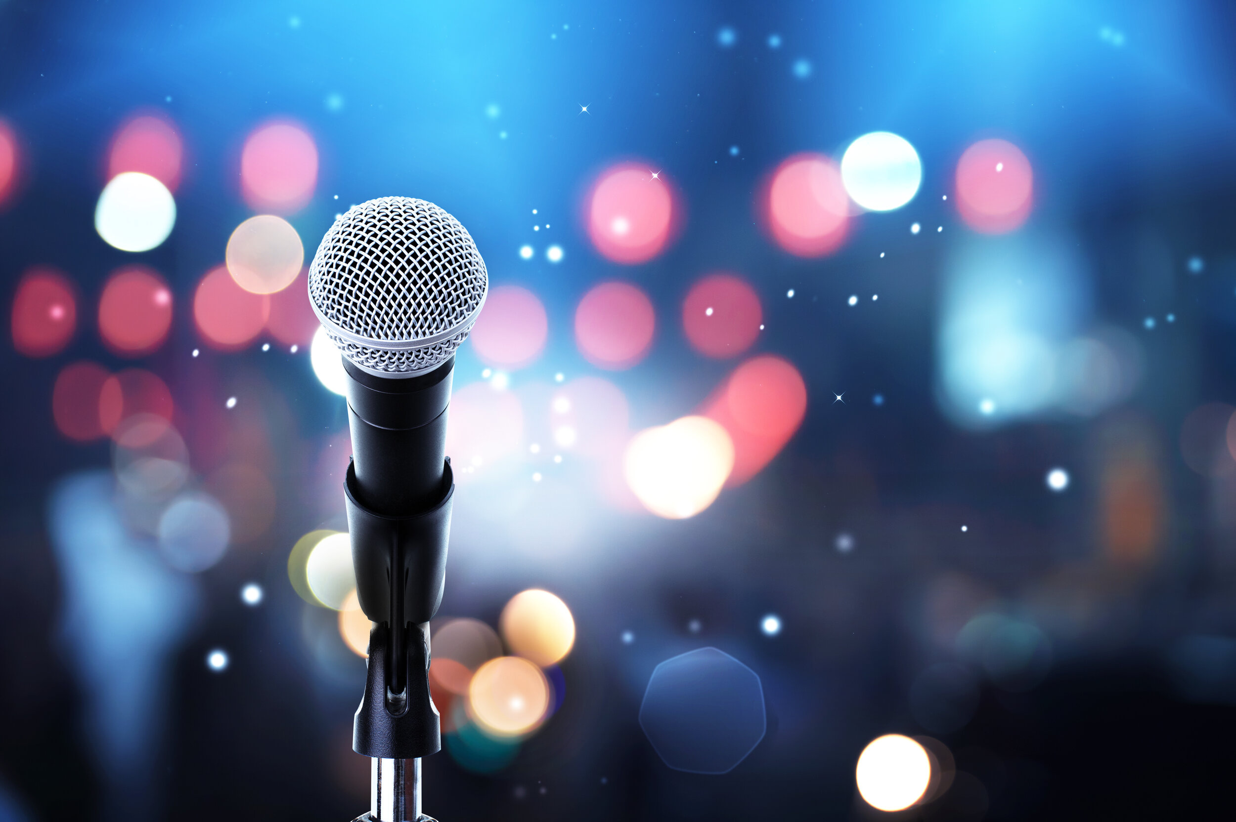 Karaoke: Singing with lyrics, displayed on a video screen, Microphone. 2500x1670 HD Background.