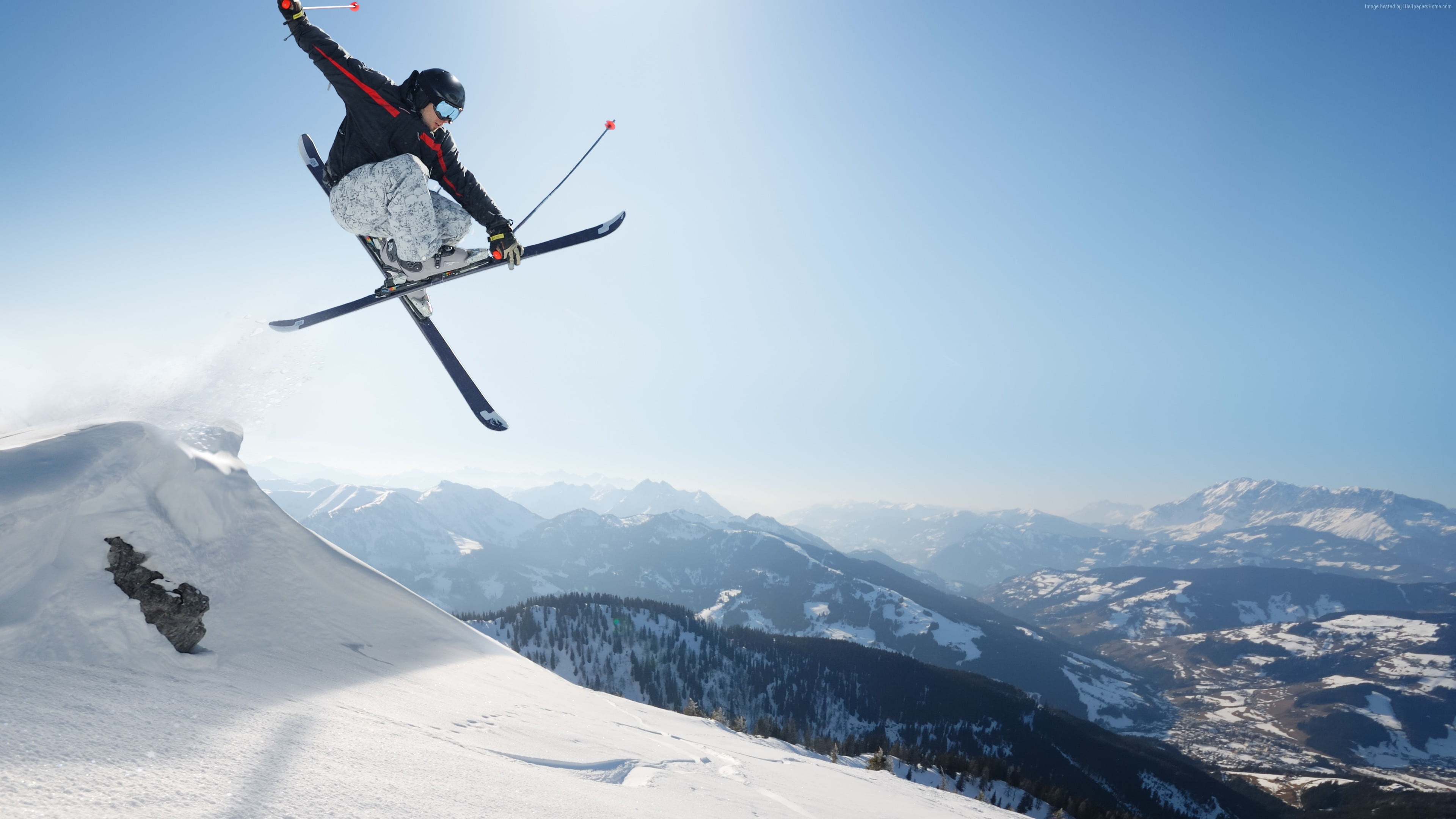 Jumping: Extreme winter sport, Downhill in a wavy course, Mountain skiing, Powder skiing. 3840x2160 4K Background.