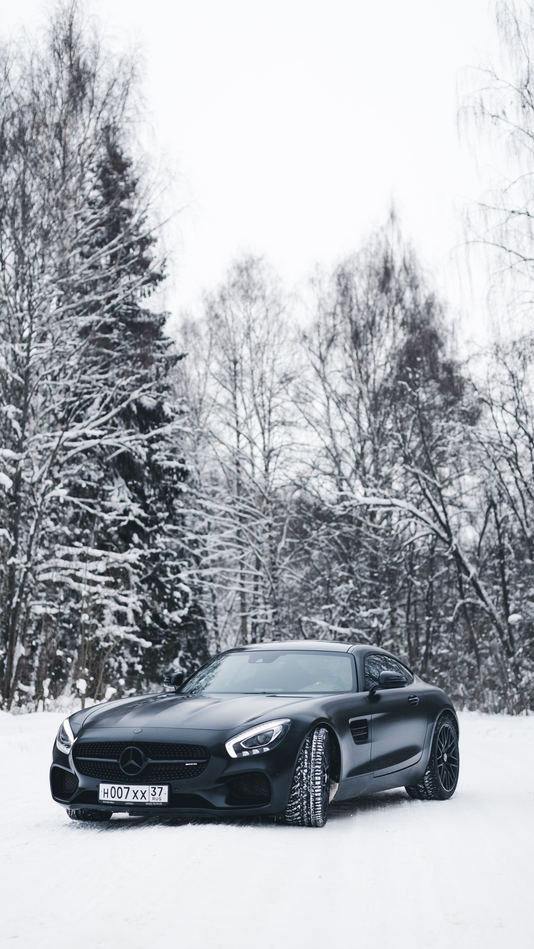 Mercedes-Benz AMG GT, Black model, Snowy background, High-resolution wallpaper, 2160x3840 4K Phone