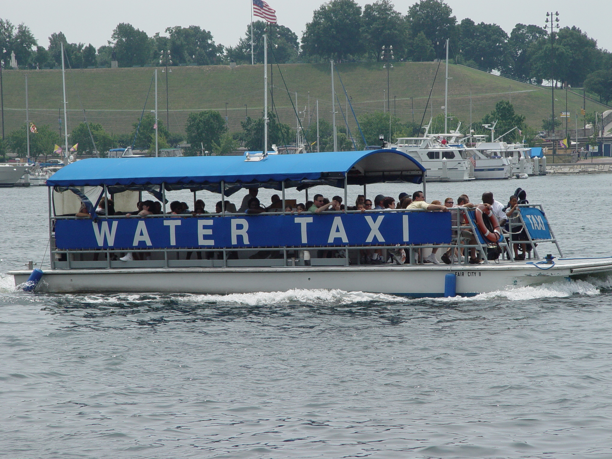 Water Taxi: A motorboat that transports passengers for a fare. 2050x1540 HD Background.