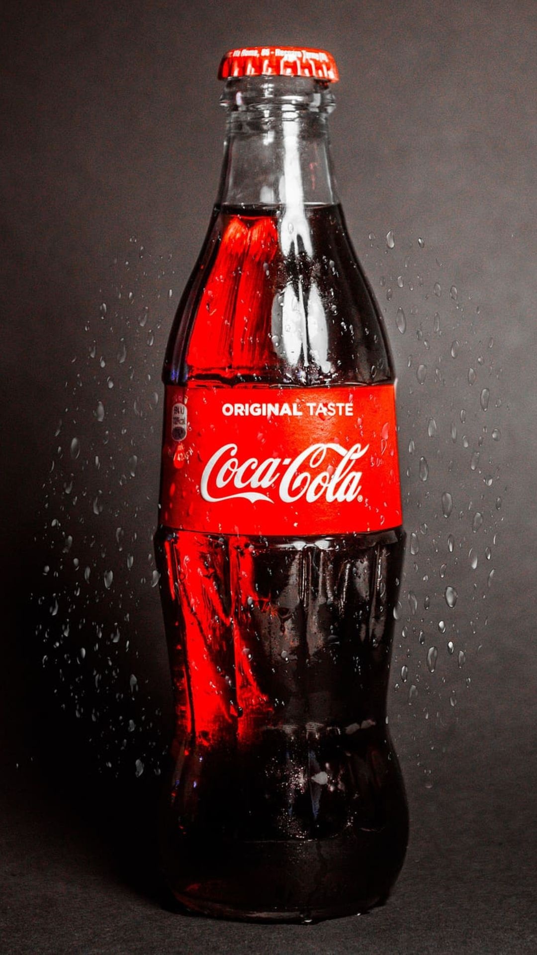 Coca-Cola: Its ingredient list today is a highly guarded secret. 1080x1920 Full HD Background.