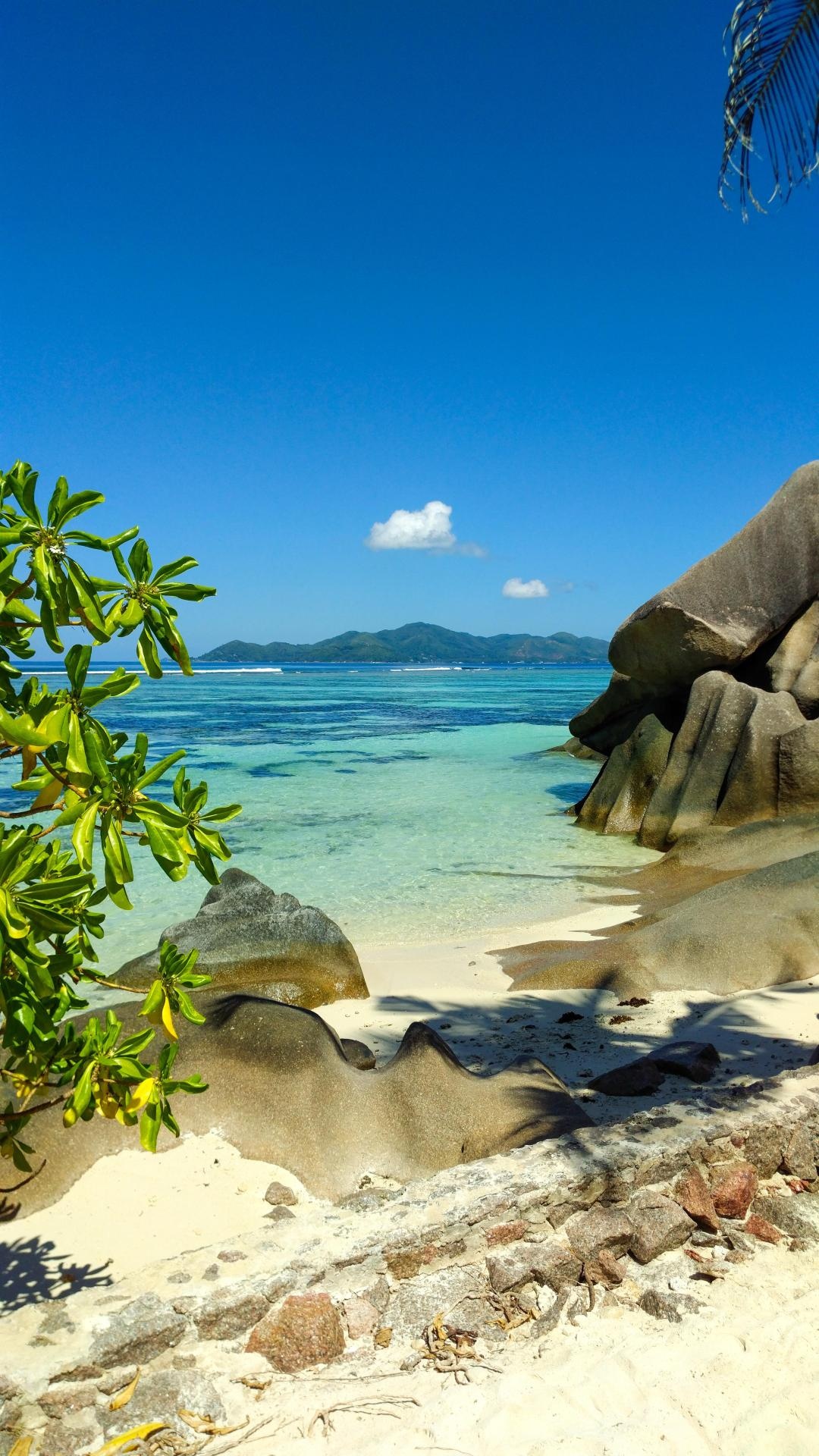 Countless beaches posts, Seychelles, 1080x1920 Full HD Phone