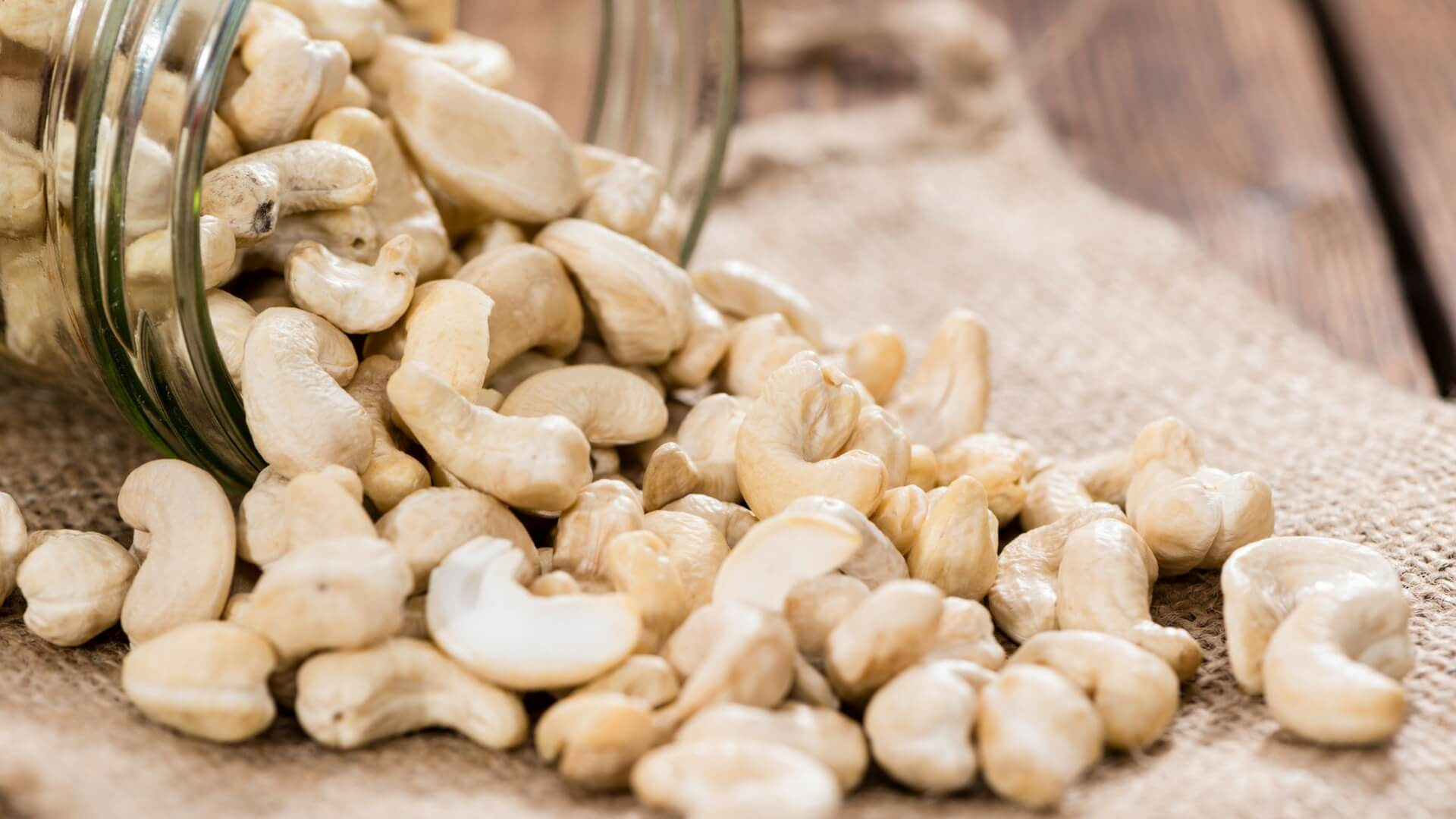 Cashew Nuts: A soft consistency and sweet flavor, Native to South America, specifically Brazil. 1920x1080 Full HD Background.