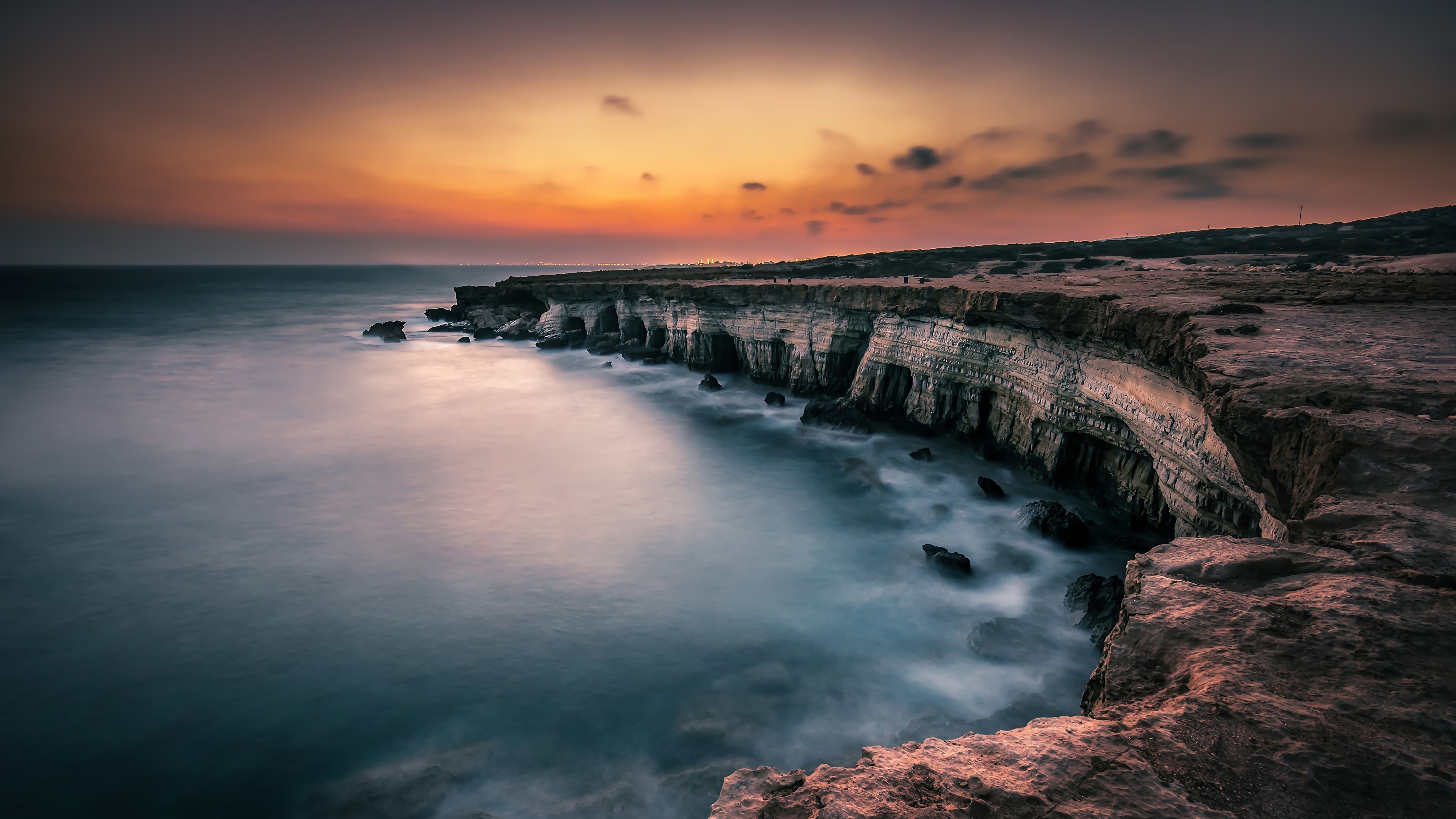 Seascape: An amazing sunset at the beach of Cyprus, Foggy water surface, Sheer cliffs. 3840x2160 4K Wallpaper.