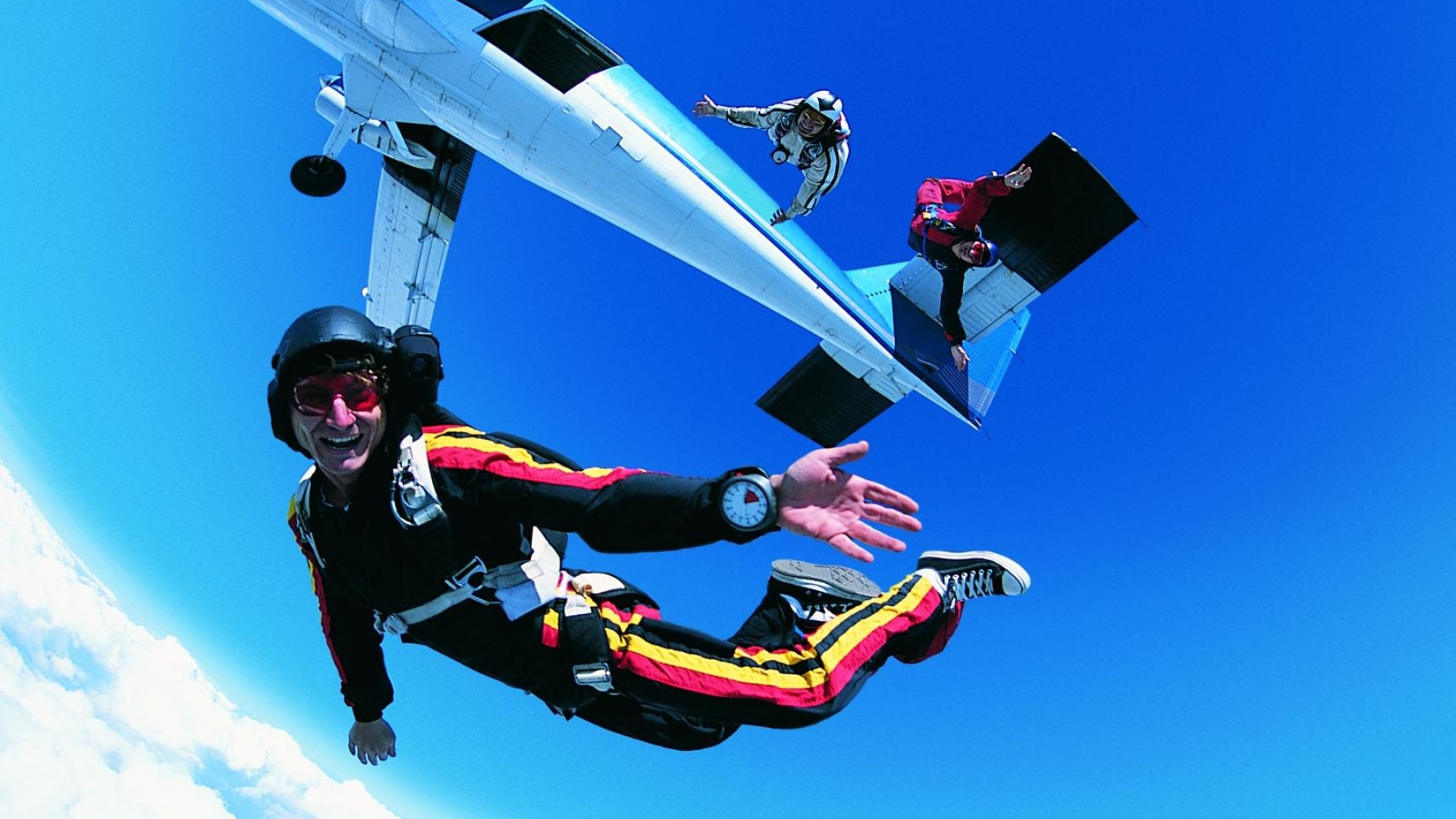 Parachuting: Conducting a free-fall jump from a parachuting aircraft, Group air sport. 1920x1080 Full HD Wallpaper.