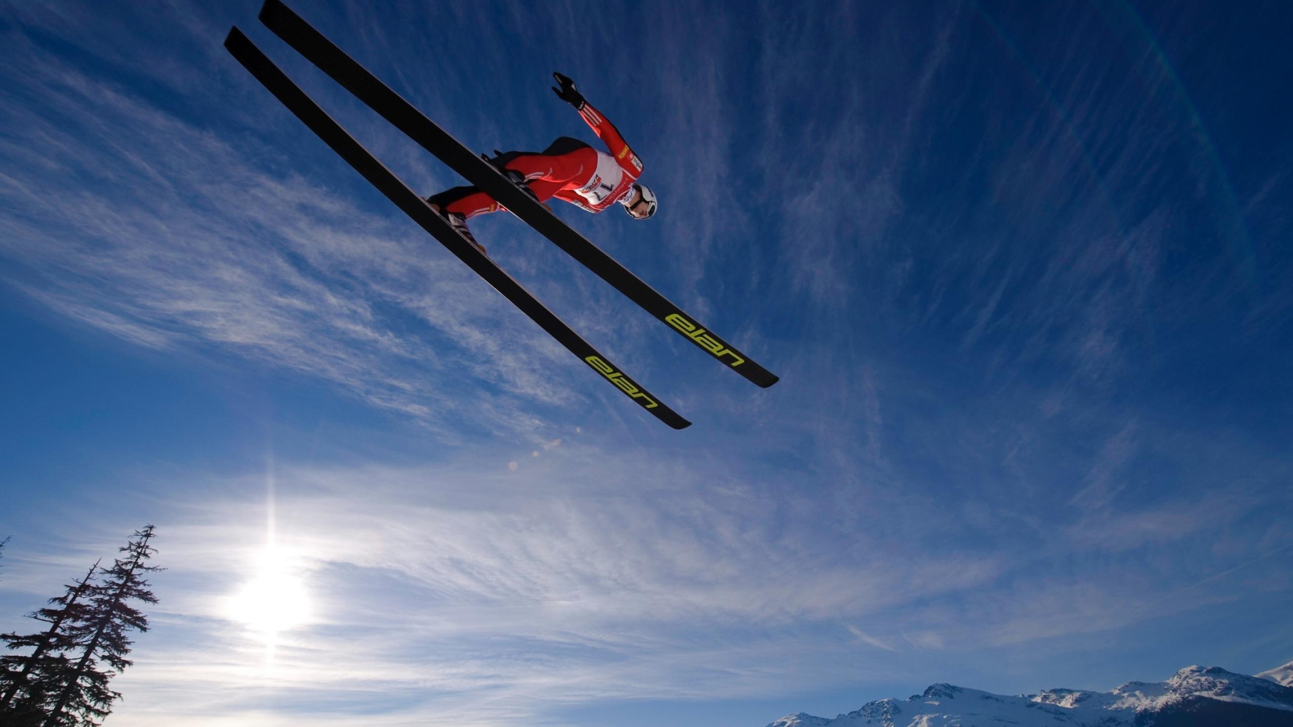 Jumping: Ski jumping, Cyclic winter sport, Mountain skiing, Flight on skis. 2560x1440 HD Wallpaper.